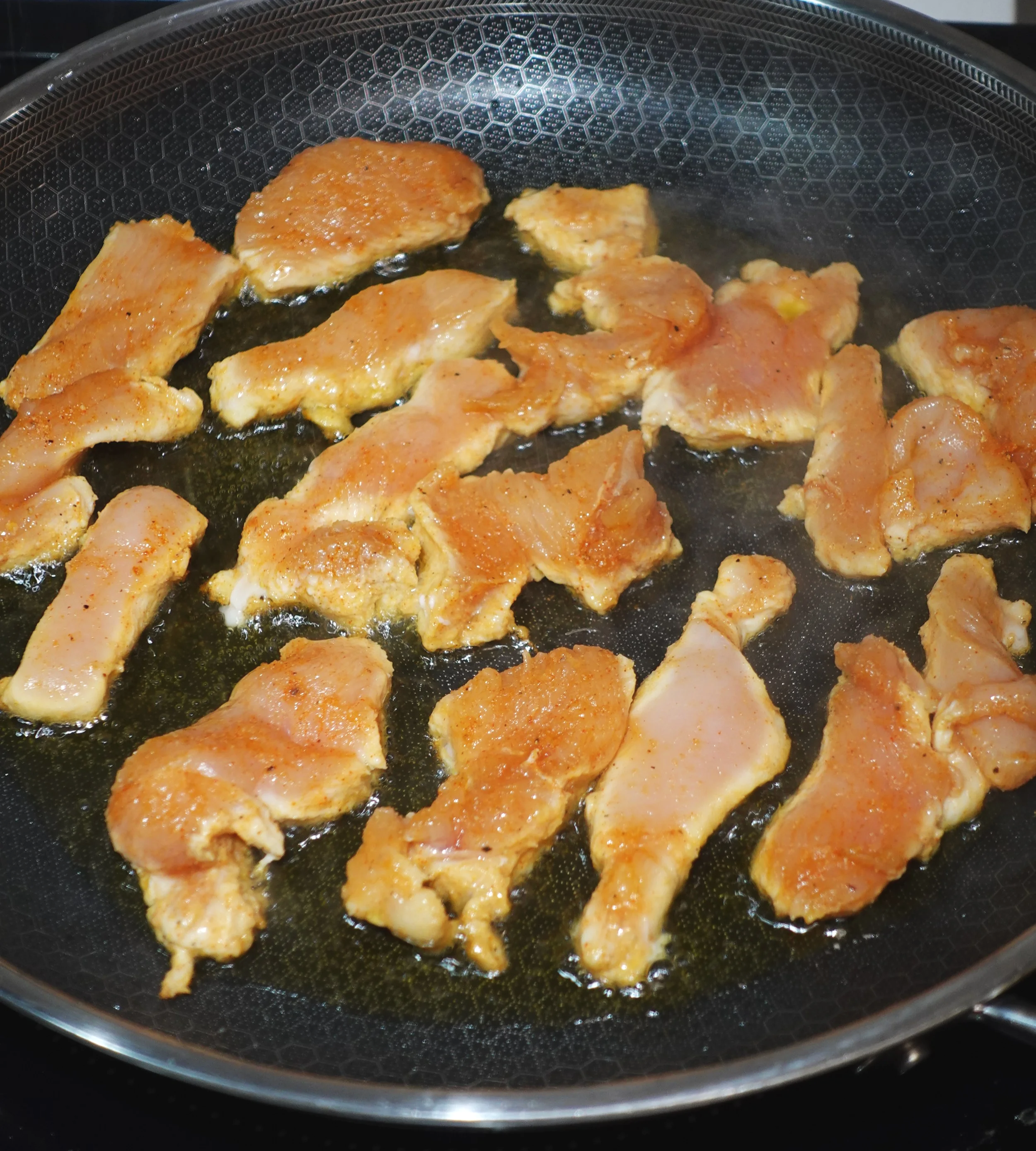 chicken breast in pan frying.JPG