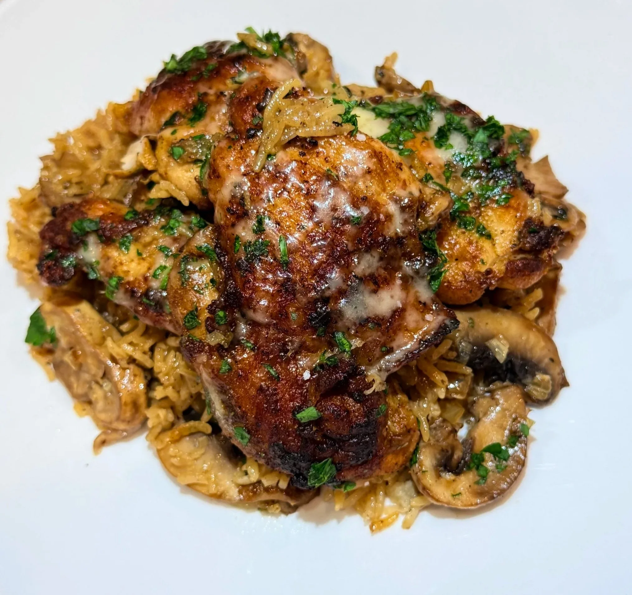 creamy mushroom chicken and rice with garlic mushrooms and herbs