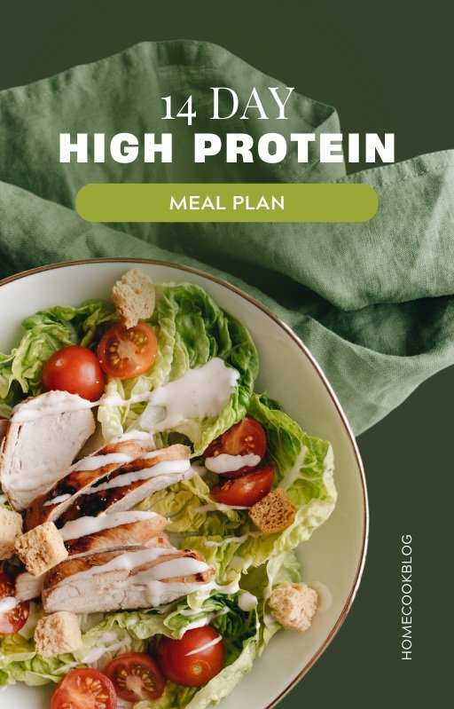 Salad with grilled chicken, cherry tomatoes, croutons, and dressing on lettuce; text overlay '14 Day High Protein Meal Plan' and 'Homecook Blog.'