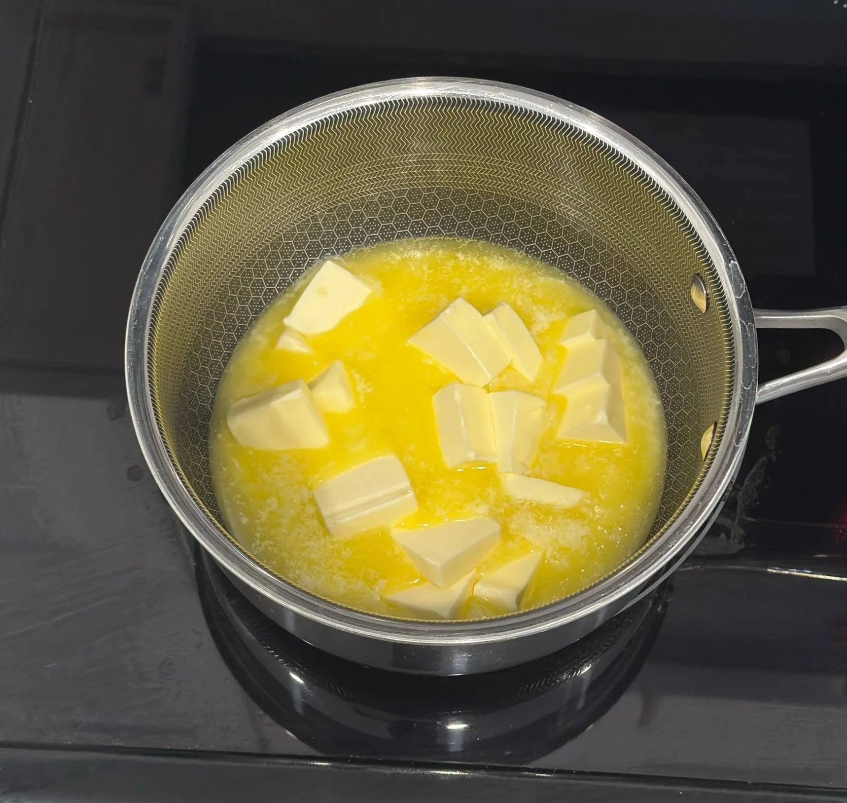 Butter melting in a saucepan for brown butter banana bread