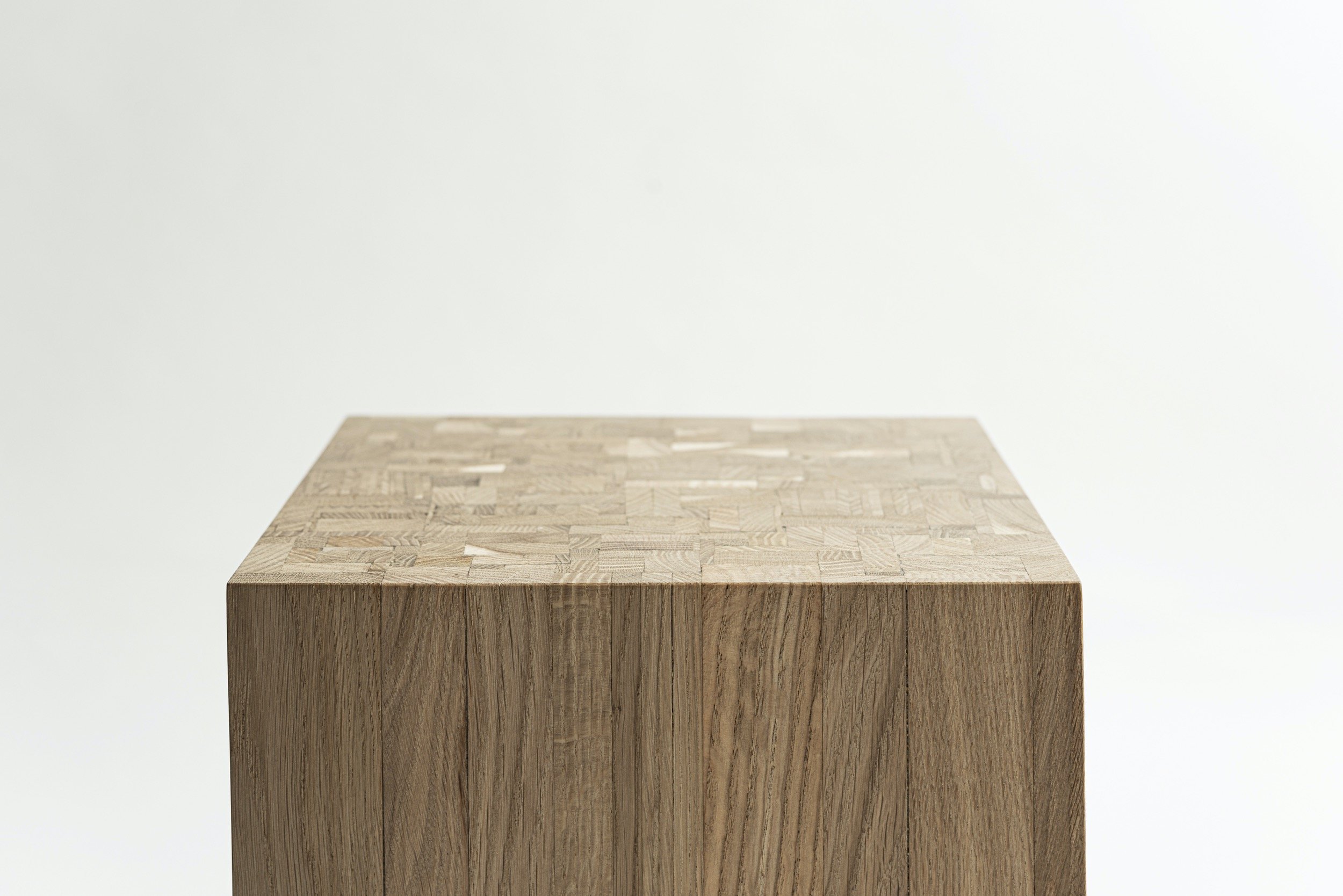 Back to Solid is a wooden block stool that we handcrafted for your home spaces. Made of 311 leftover oak planks. Put together in a random order back to solid oak. The Oak. Long Live the Oak.