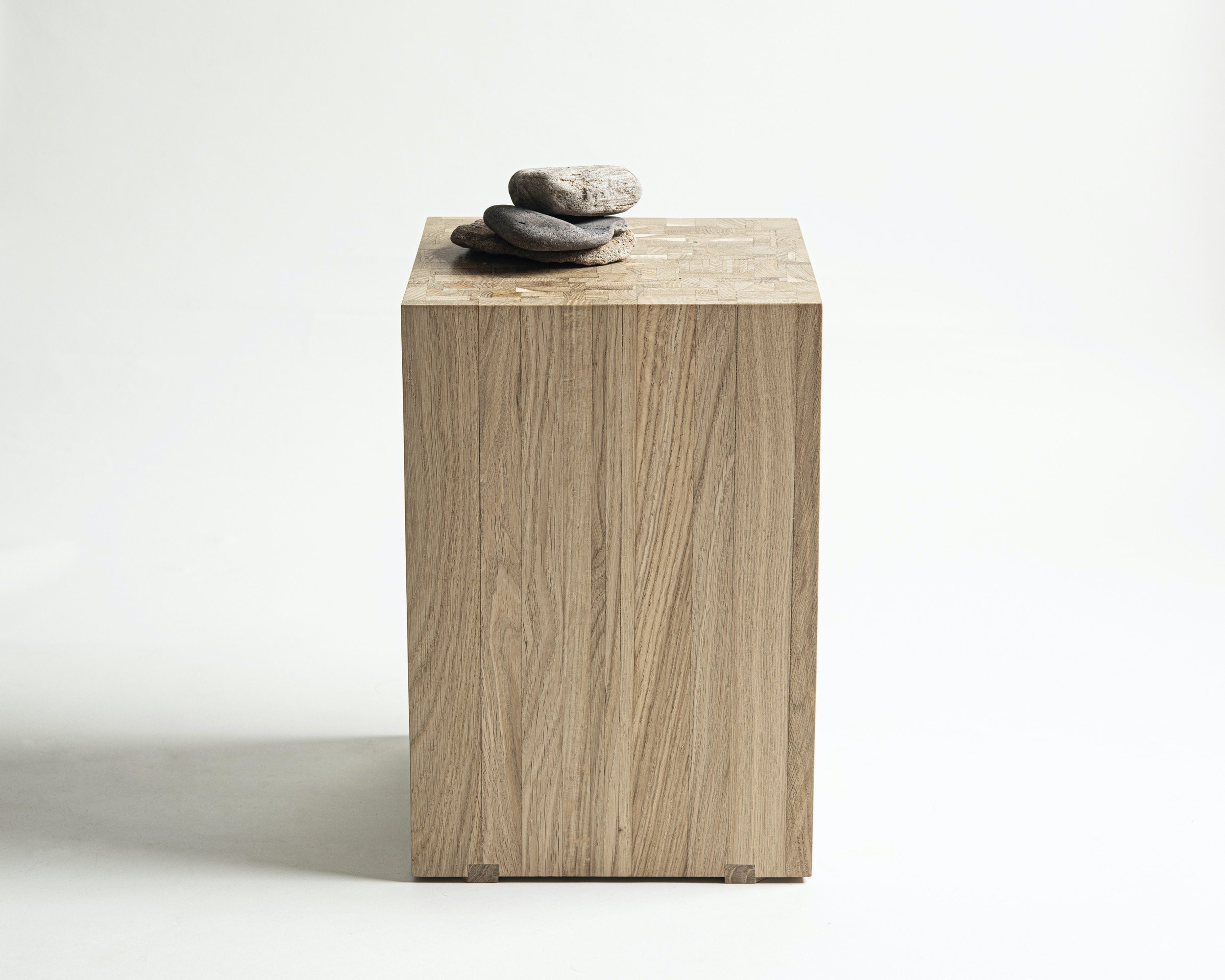 Back to Solid is a wooden block stool that we handcrafted for your home spaces. Made of 311 leftover oak planks. Put together in a random order back to solid oak. The Oak. Long Live the Oak.