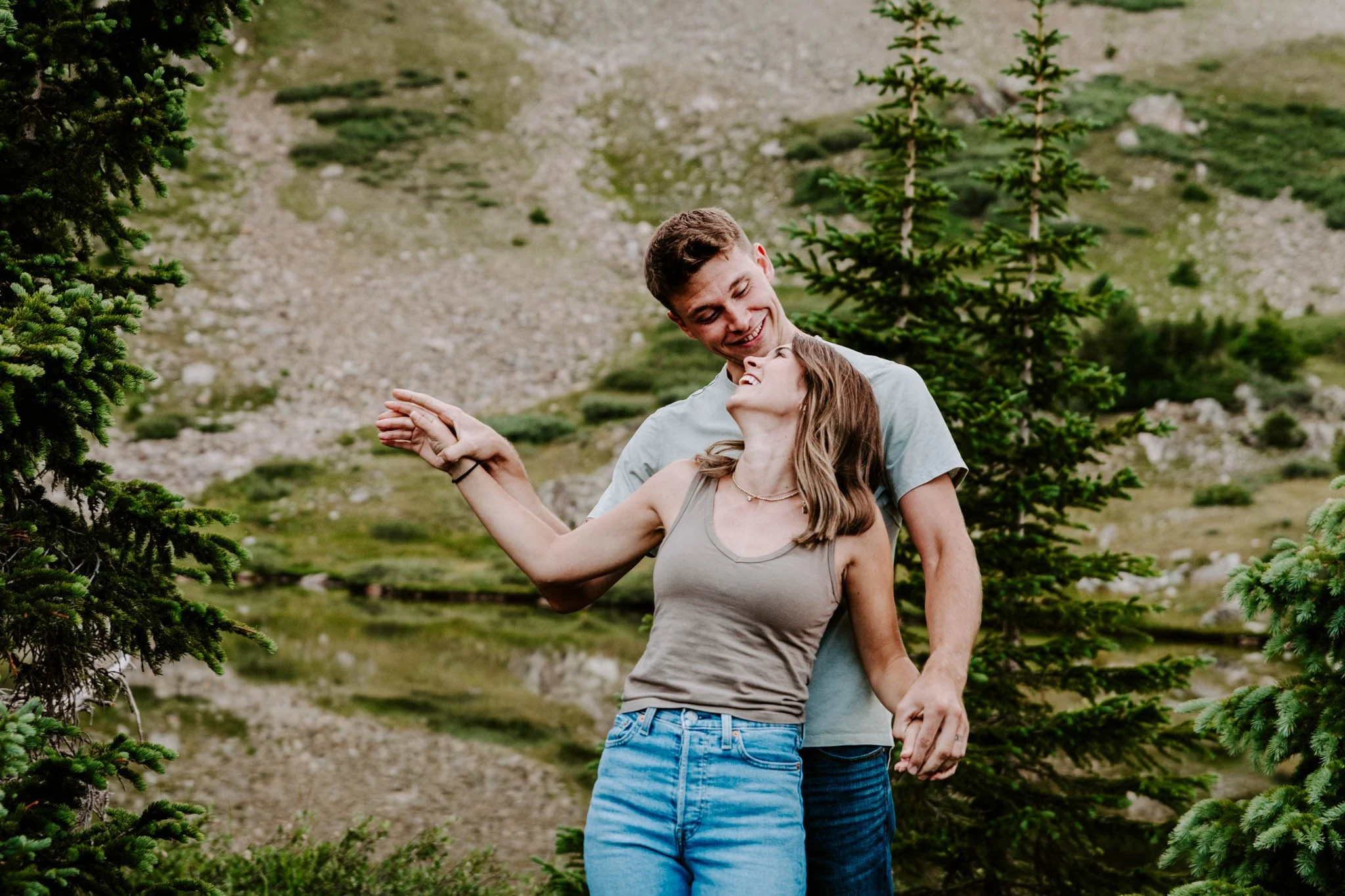 Couple taking romantic sunset portraits at loveland pass in colorado