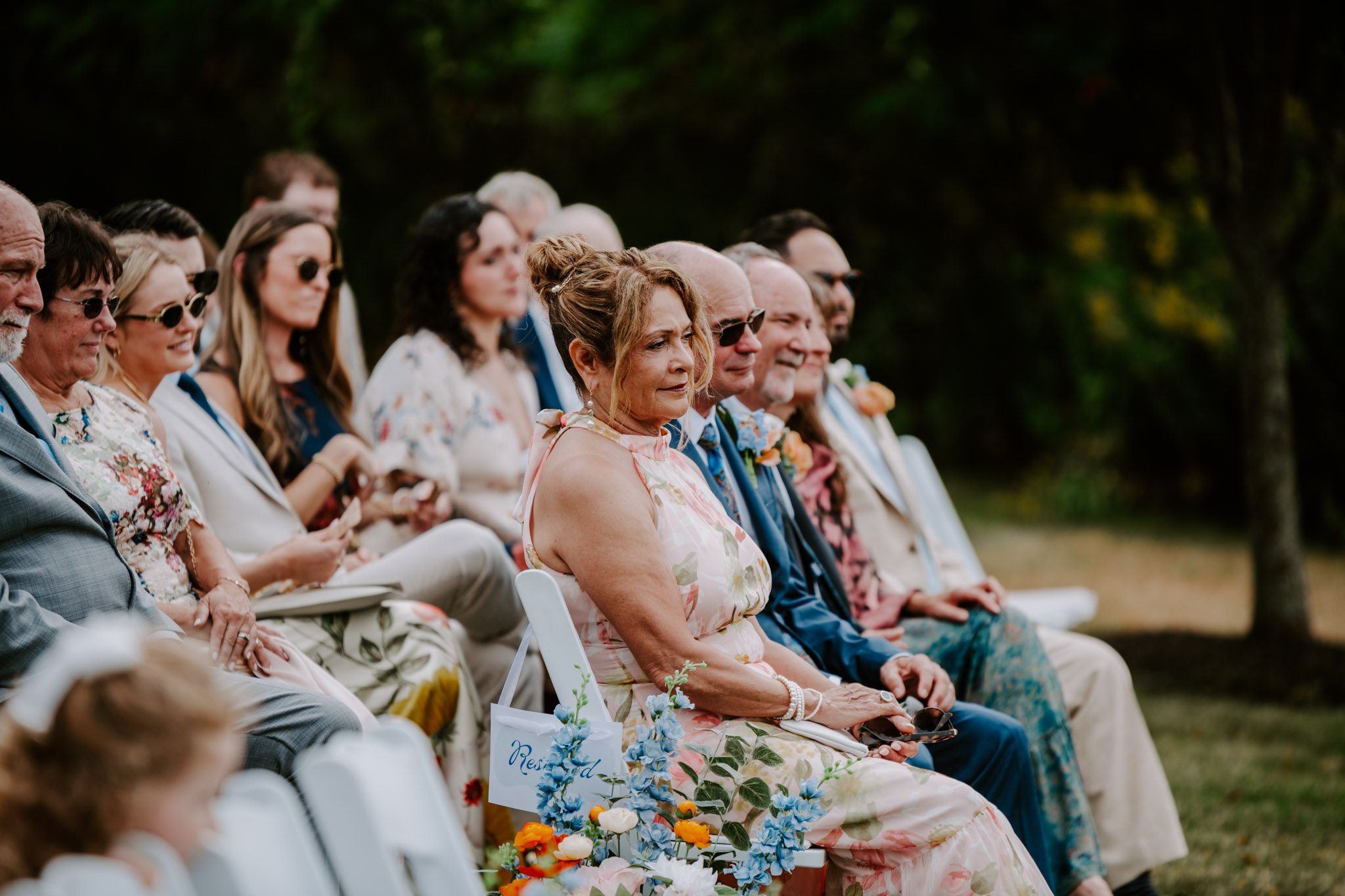 Guests observing a wedding ceremony at a fall wedding
