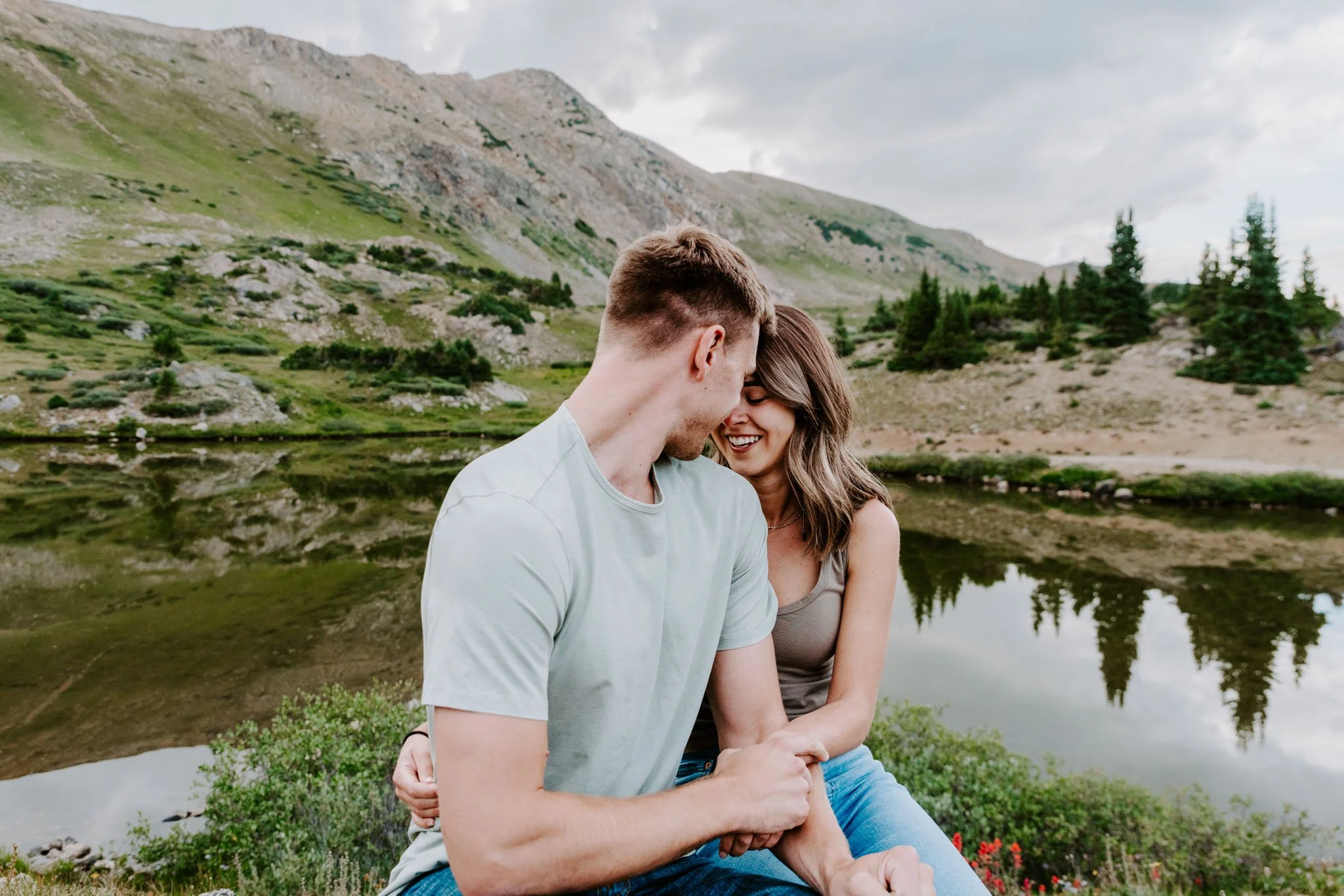 Couple taking romantic sunset portraits at loveland pass in colorado