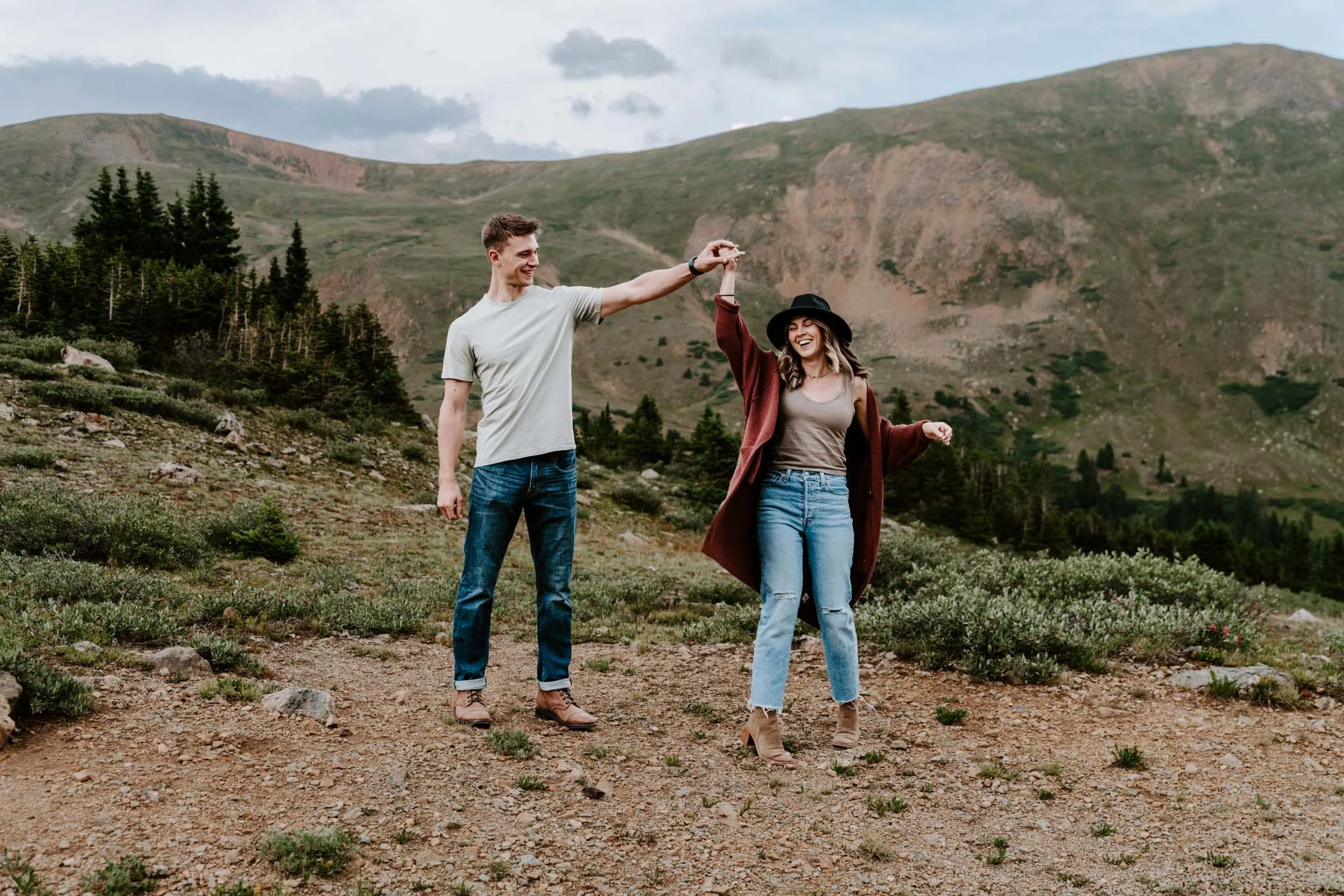 Couple taking romantic sunset portraits at loveland pass in colorado