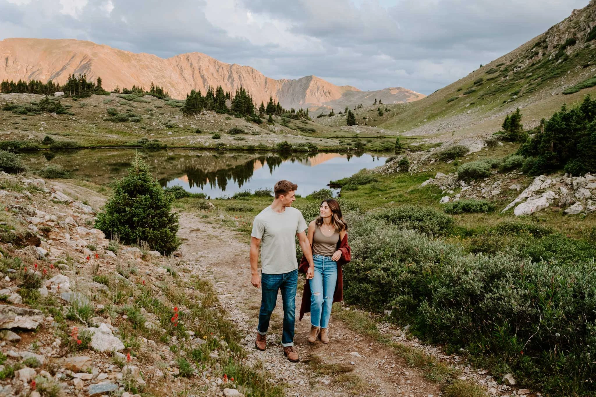 Couple taking romantic sunset portraits at loveland pass in colorado