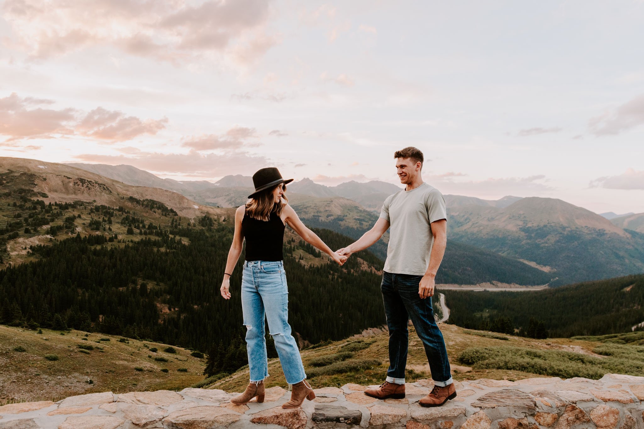 Couple taking romantic sunset portraits at loveland pass in colorado