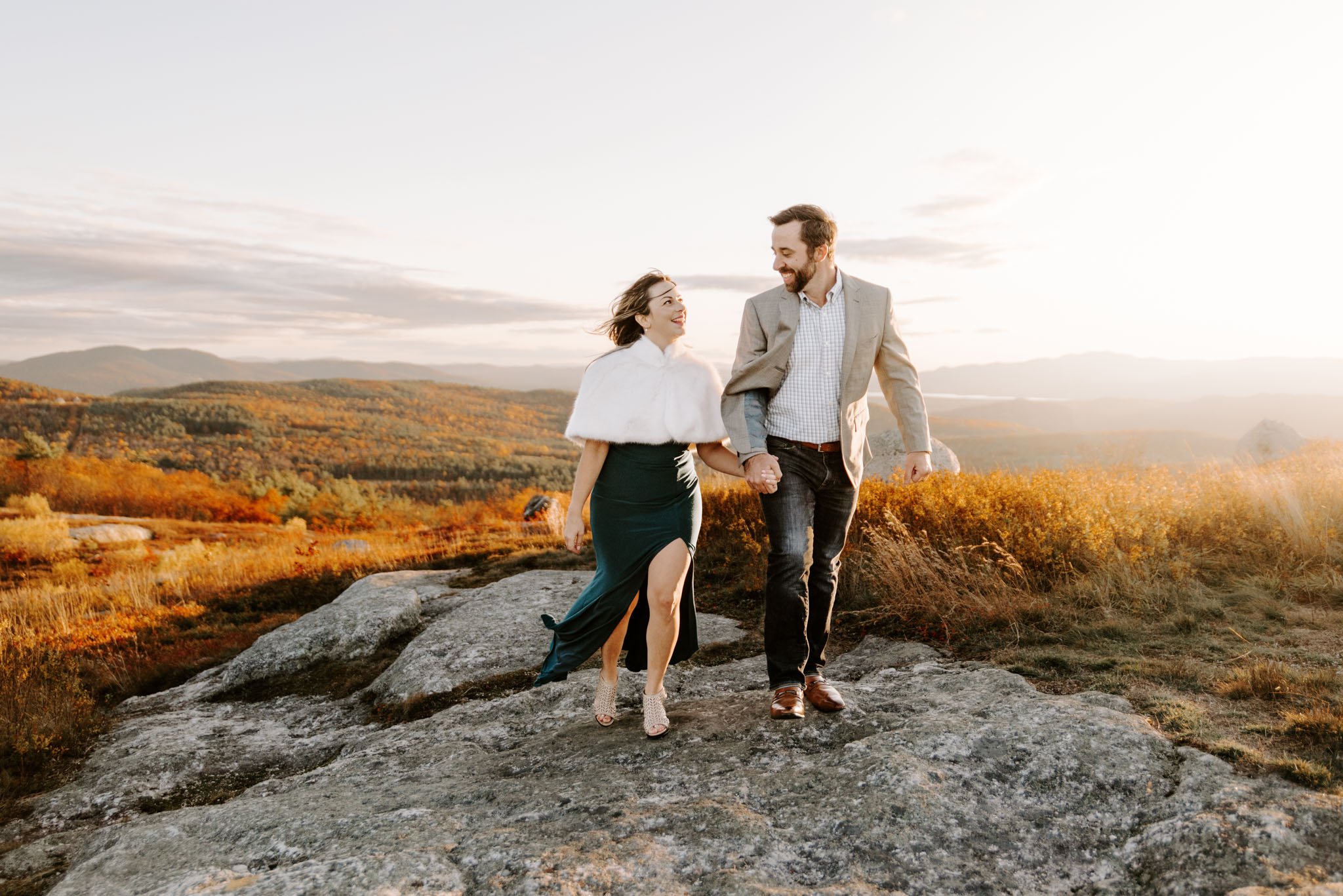 Couple celebrating their engagement in the fall in the mountains