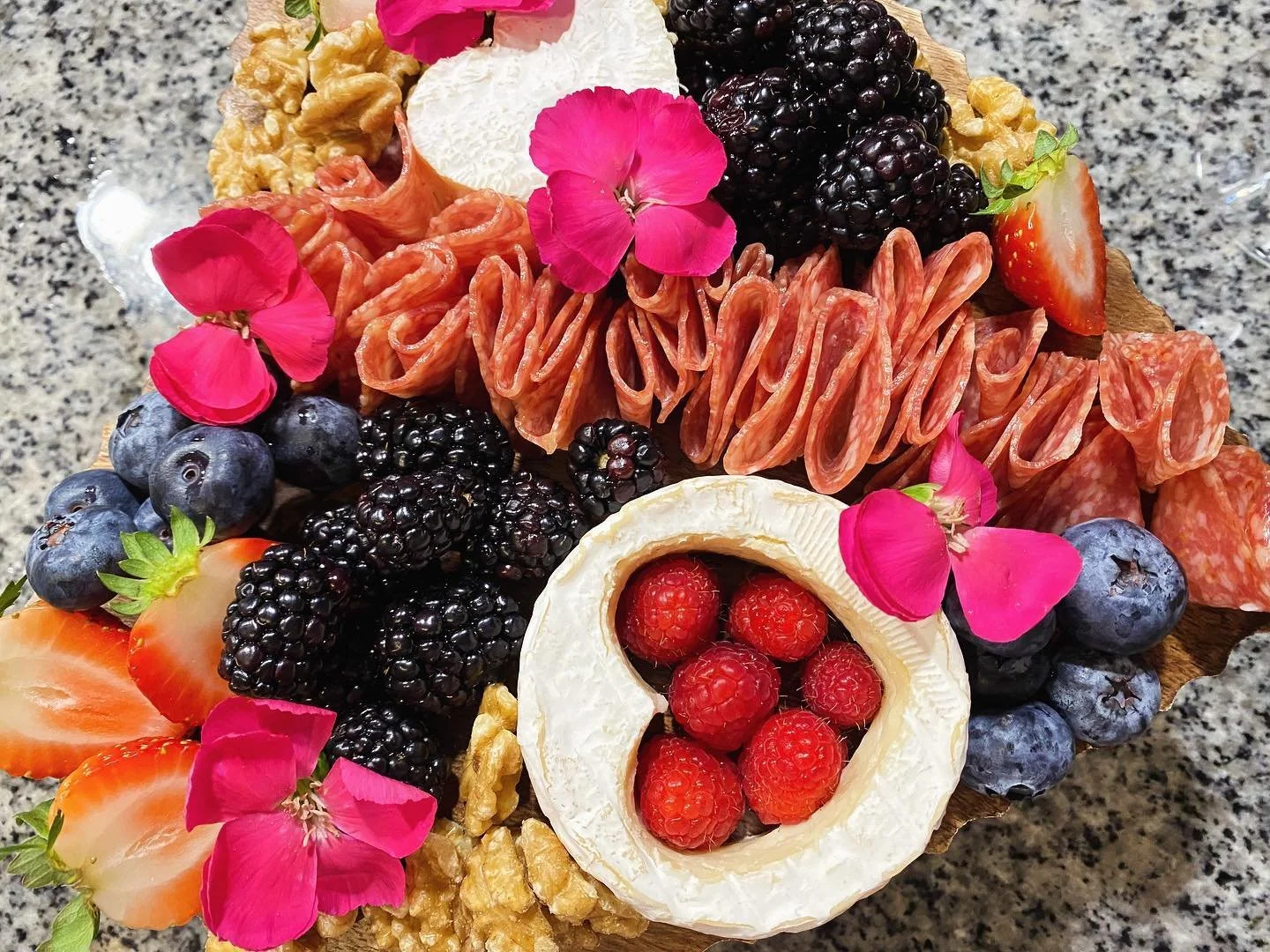 We&rsquo;re so excited to finally introduce this lovely G.O.A.T. board to you all! This is our featured &ldquo;Seasons of Love&rdquo; Board for Valentine&rsquo;s Day! 🩷🧀🍷 This board features heart shaped camembert cheese, aged cheddar, dark chocol