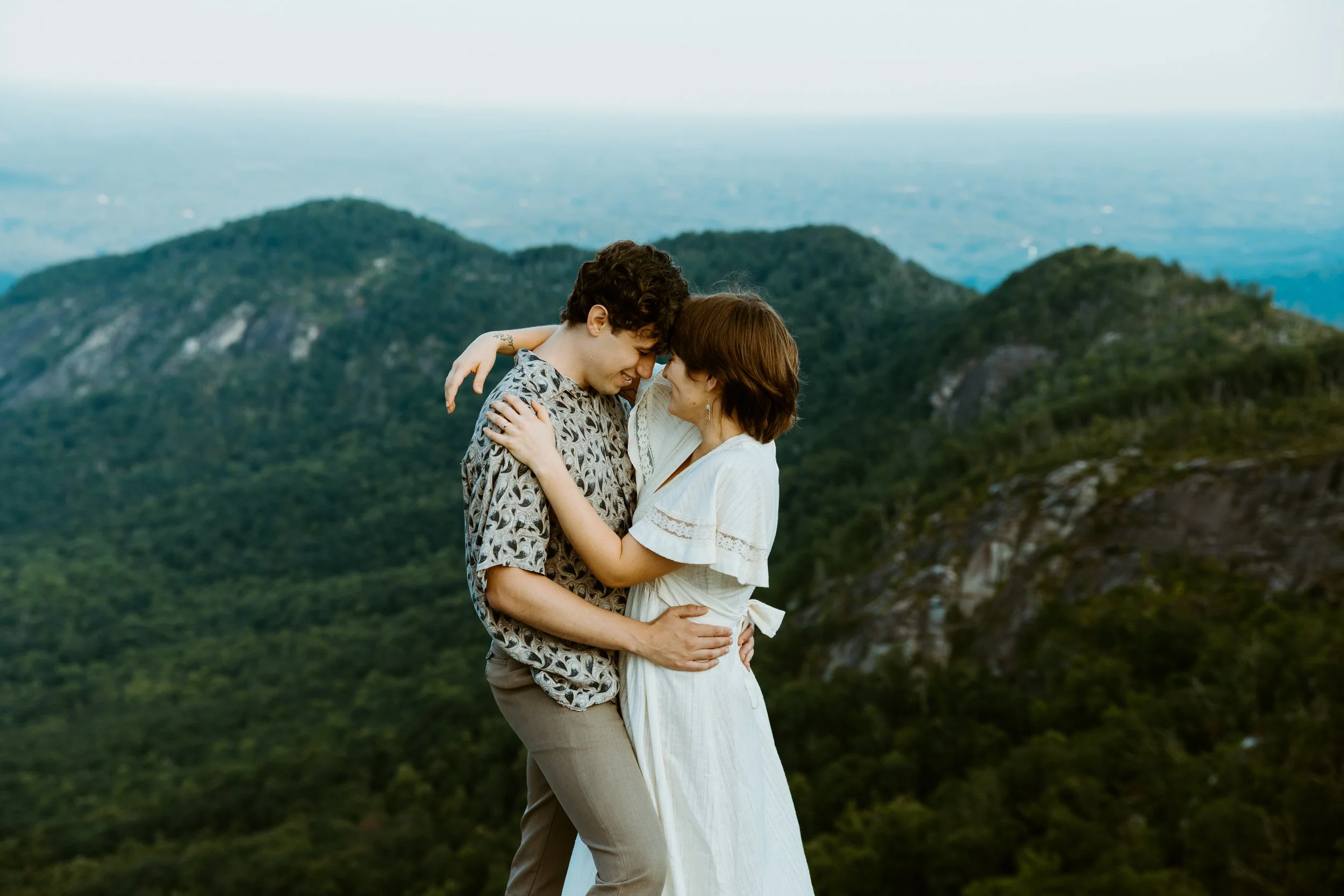 Couple elopes in NC and has a private vow exchange on top of a mountain overlooking the blue ridge parkway.