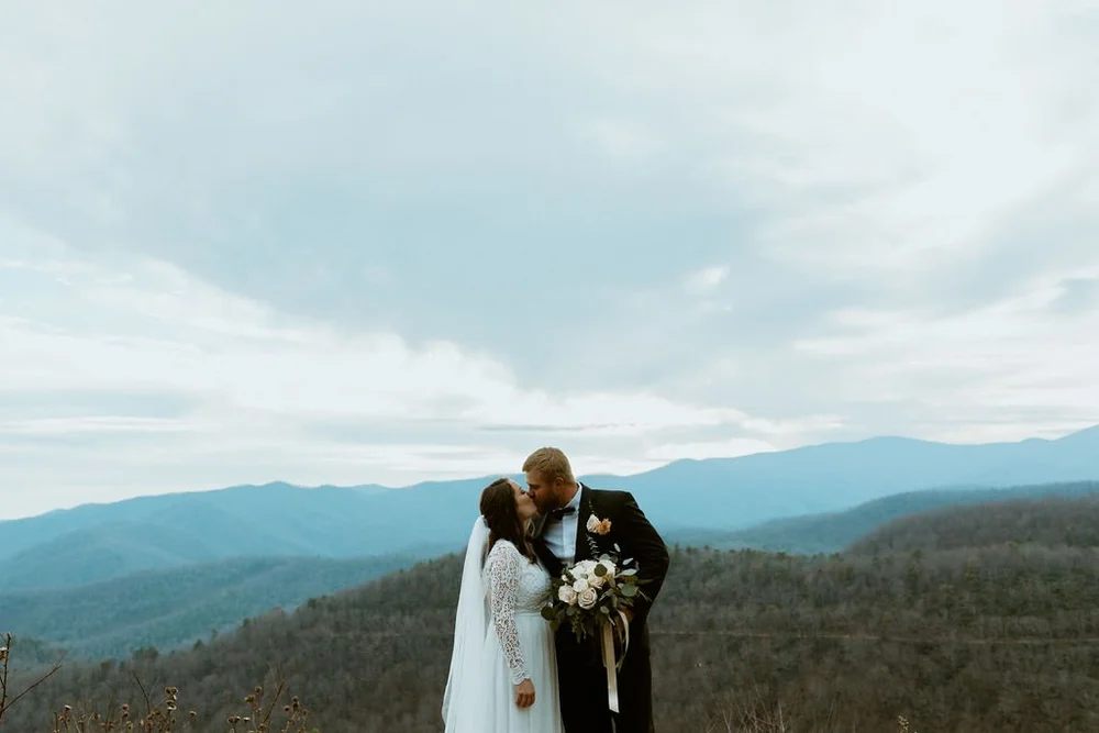 Couple share their first kiss after their vow exchange.