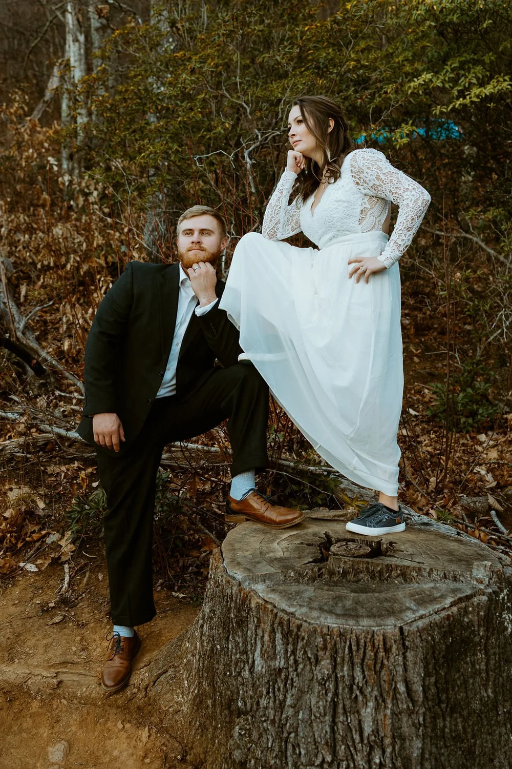 Couple shares a funny photo moment as they adventure around a blue ridge parkway overlook after sharing their private vows.