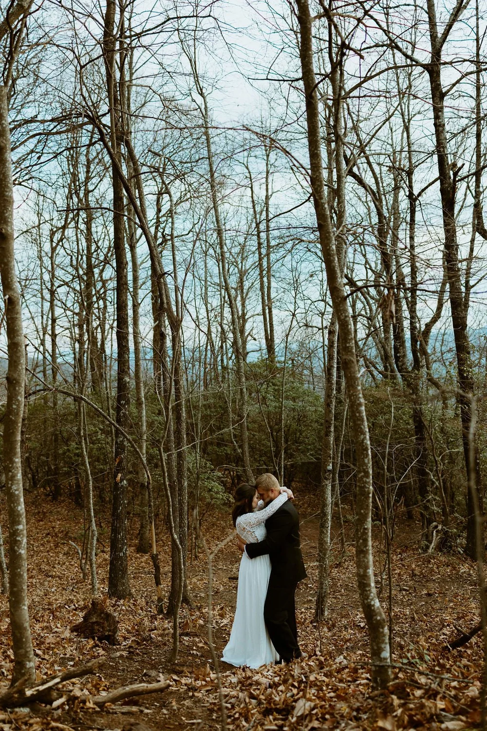 Couple shares a private embrace after they elope in North Carolina.
