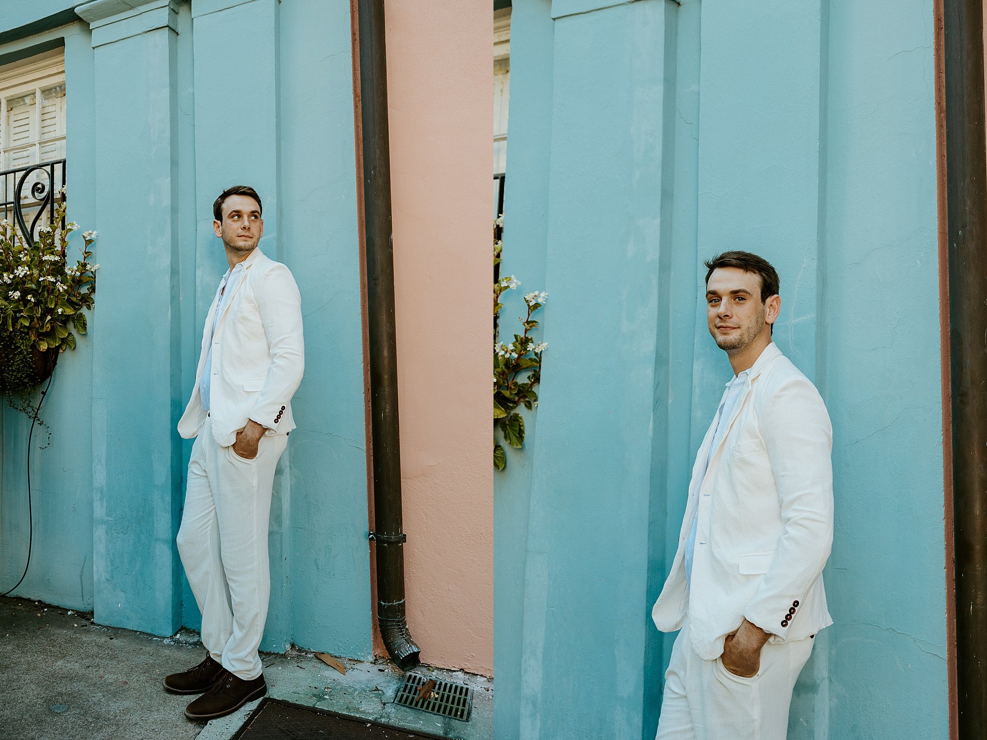 Groom stands against a colorful wall in Rainbow Row in Charleston SC before he elopes
