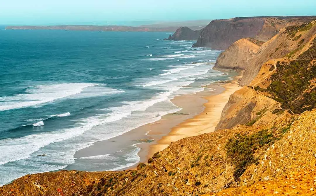 View along the rugged western Algarve coastline with cliffs, sandy beaches and Atlantic waves