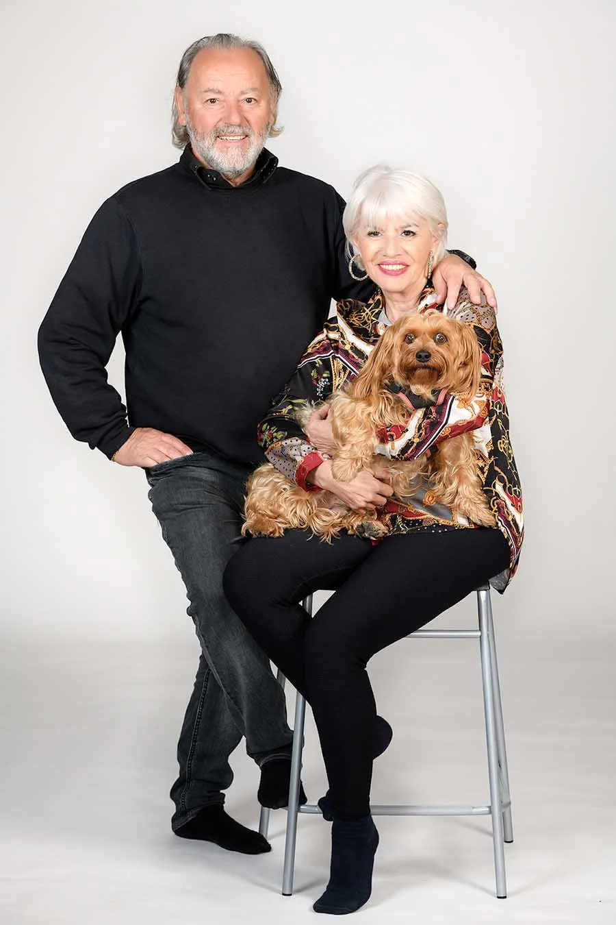 Relaxed studio portrait of a couple with their dog photographed in the Algarve