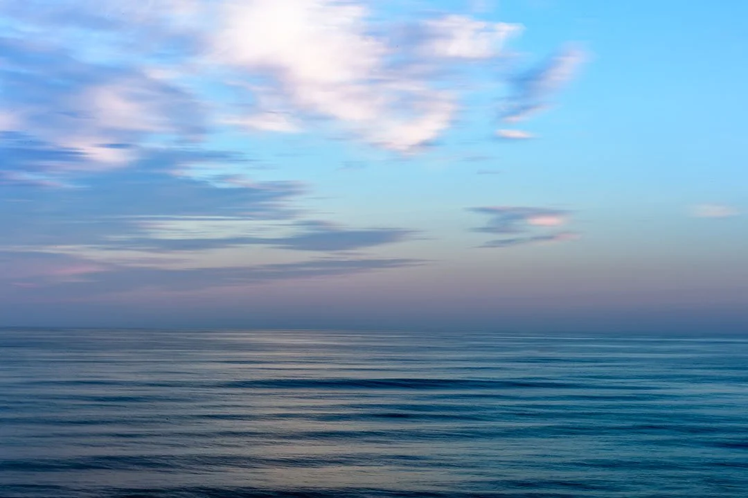 Abstract coastal seascape created using intentional camera movement on an Algarve beach