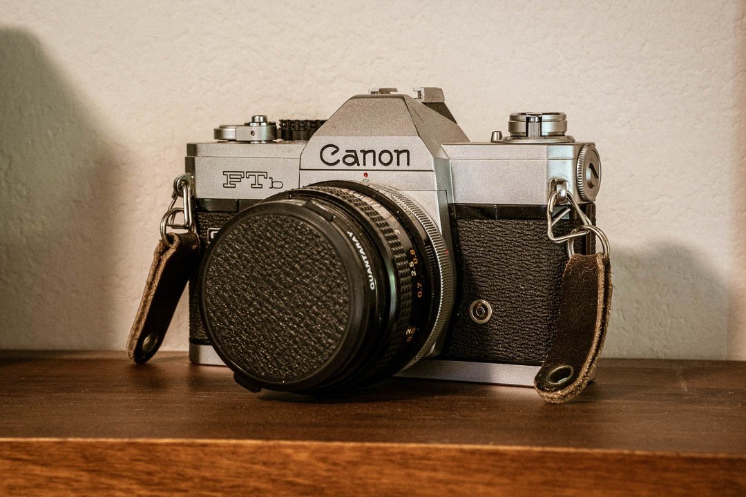 An old type of Canon camera with a fixed lens
