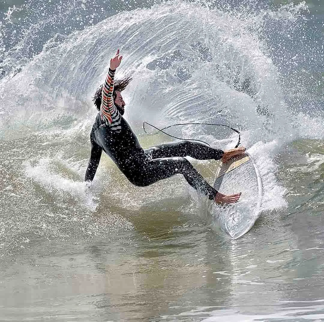 Surfer in action catching the waves in the Algarve