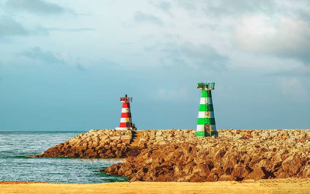 Red and green lighthouses marking the entrance to Vilamoura harbour