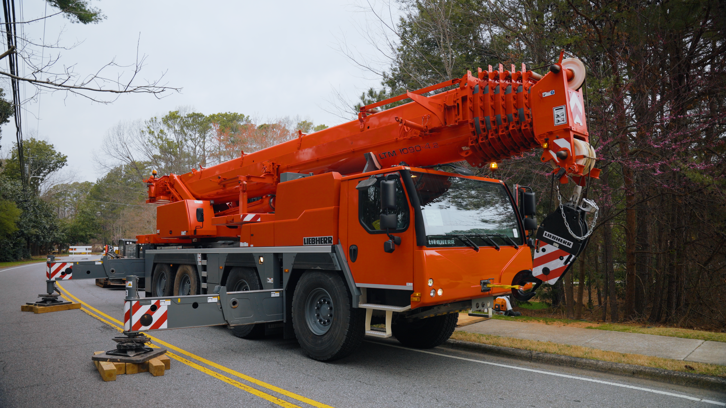 Beasley Tree Experts 110-ton Liebherr crane set up for emergency tree removal in Cherokee County, Georgia
