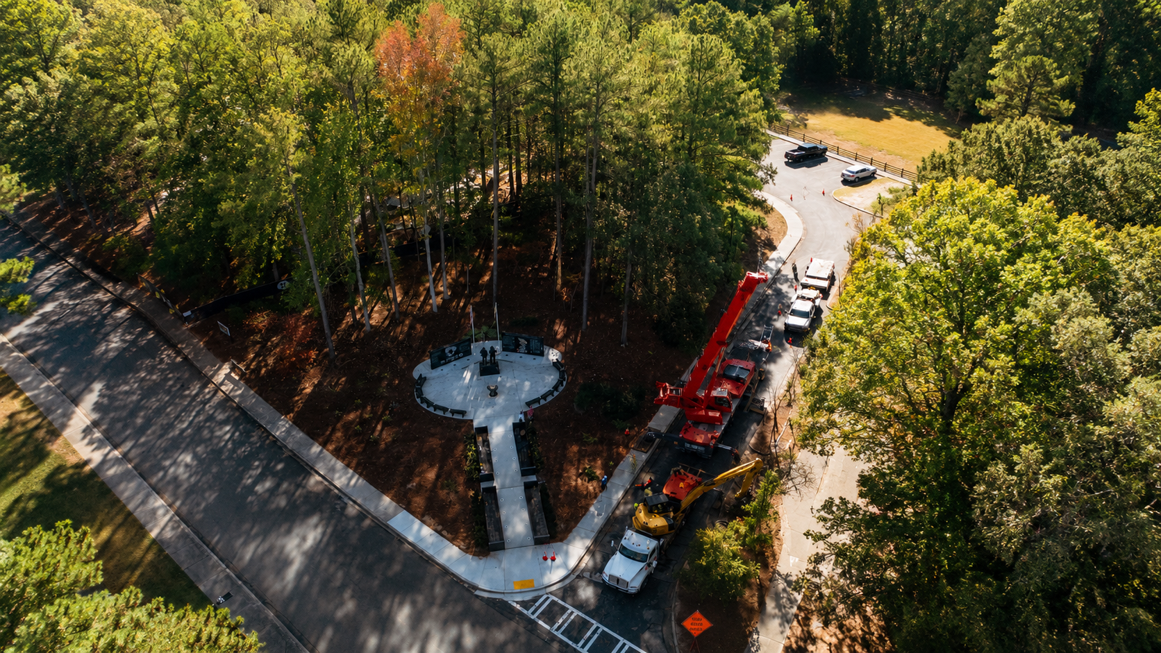 Crane removing a hazardous tree in a public park in North Georgia