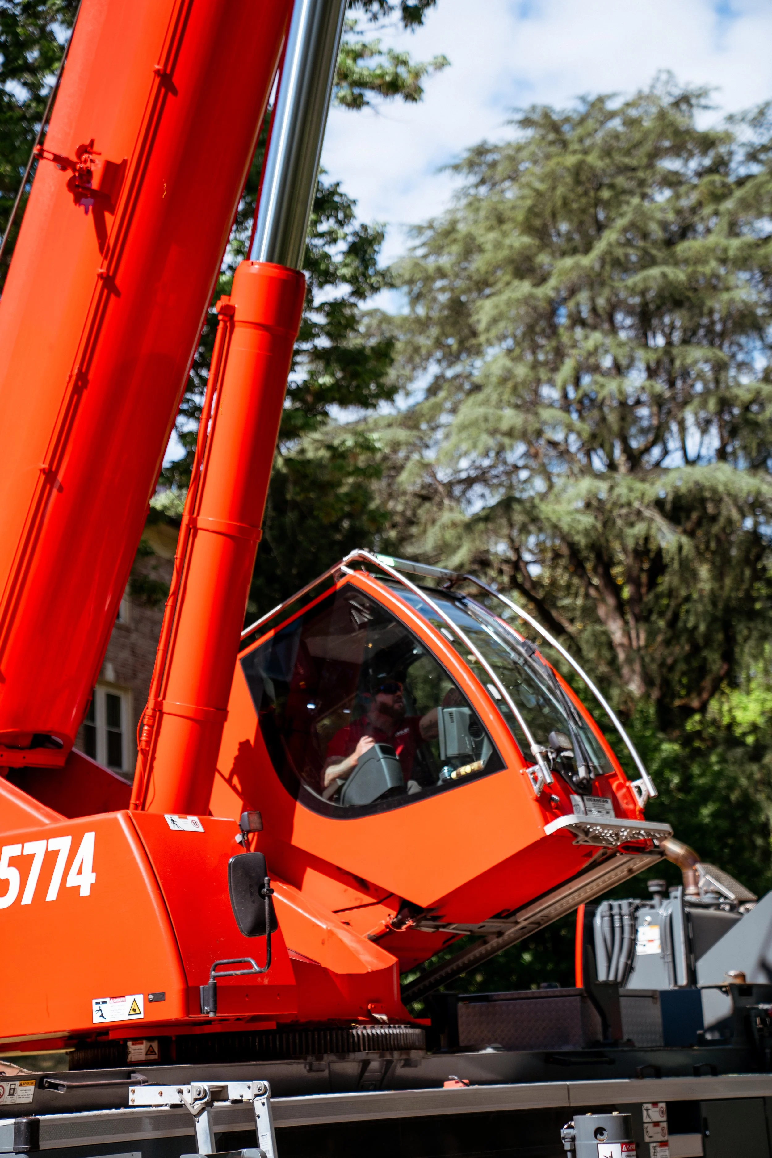 Close-up of crane cab and boom during NCCCO certified municipal tree work