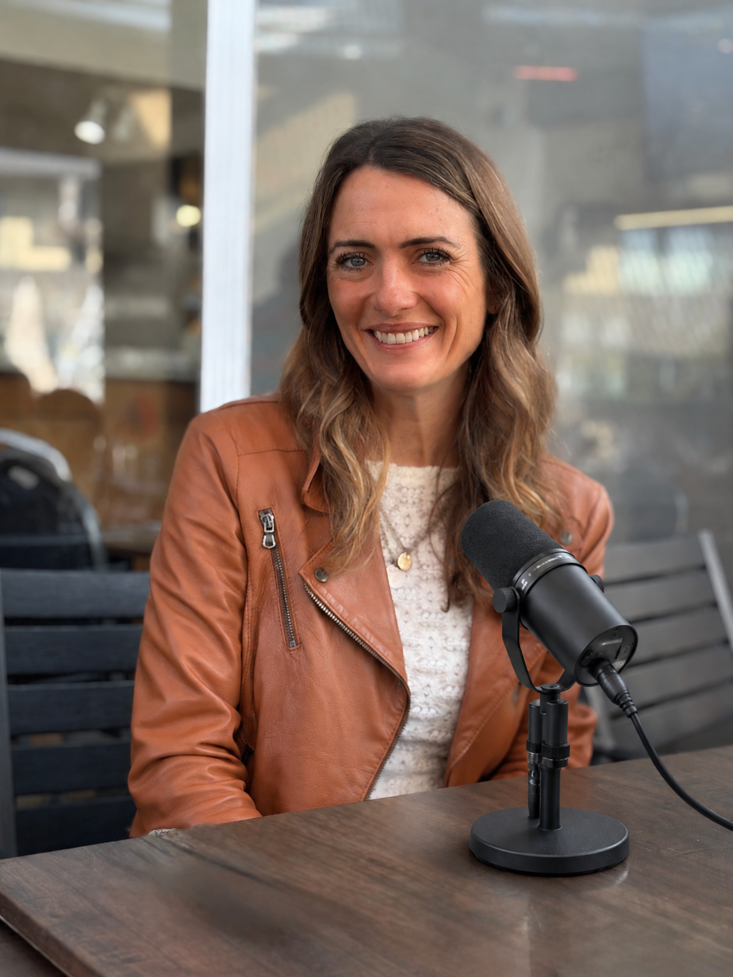 Priscillia de Muizon sitting at table with microphone