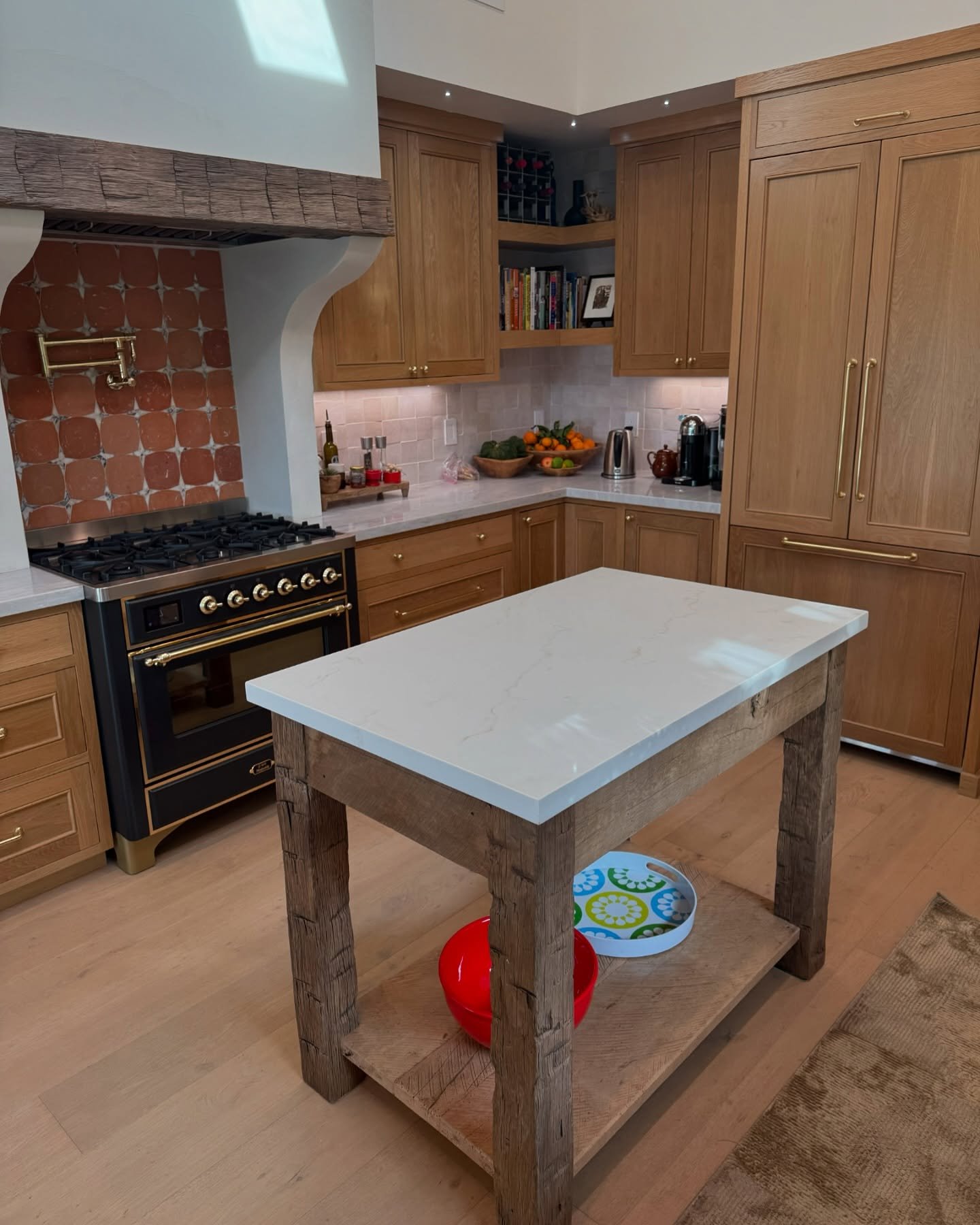 Recognize this kitchen? 🏡✨ Last year, we crafted the hand-hewn hood trim, and now we&rsquo;ve built a custom kitchen island with hand-hewn legs to bring it all together. 
&bull;
&bull;
&bull;
#usreclaimed #kitchenisland #handhewn #reclaimedfurniture