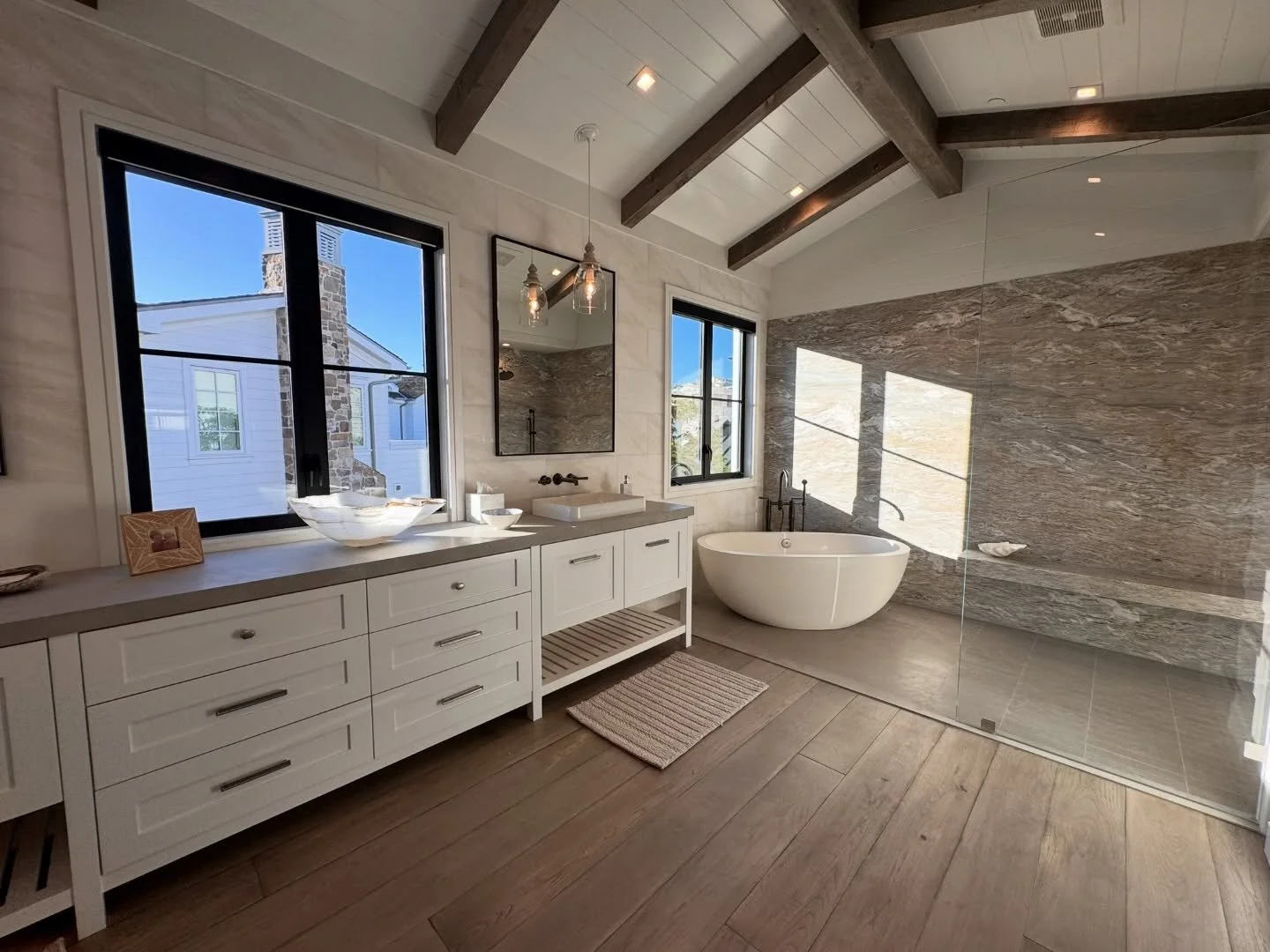 Ceiling beams shouldn&rsquo;t stop at the doorway. Bringing them into the bathroom ties it all together. 🛁

Ready to carry your design all the way through?
📩 DM us to get started.
.
.
.
#vaultedceilings #reclaimedwoodbeams #ceilingbeams #bathroomre