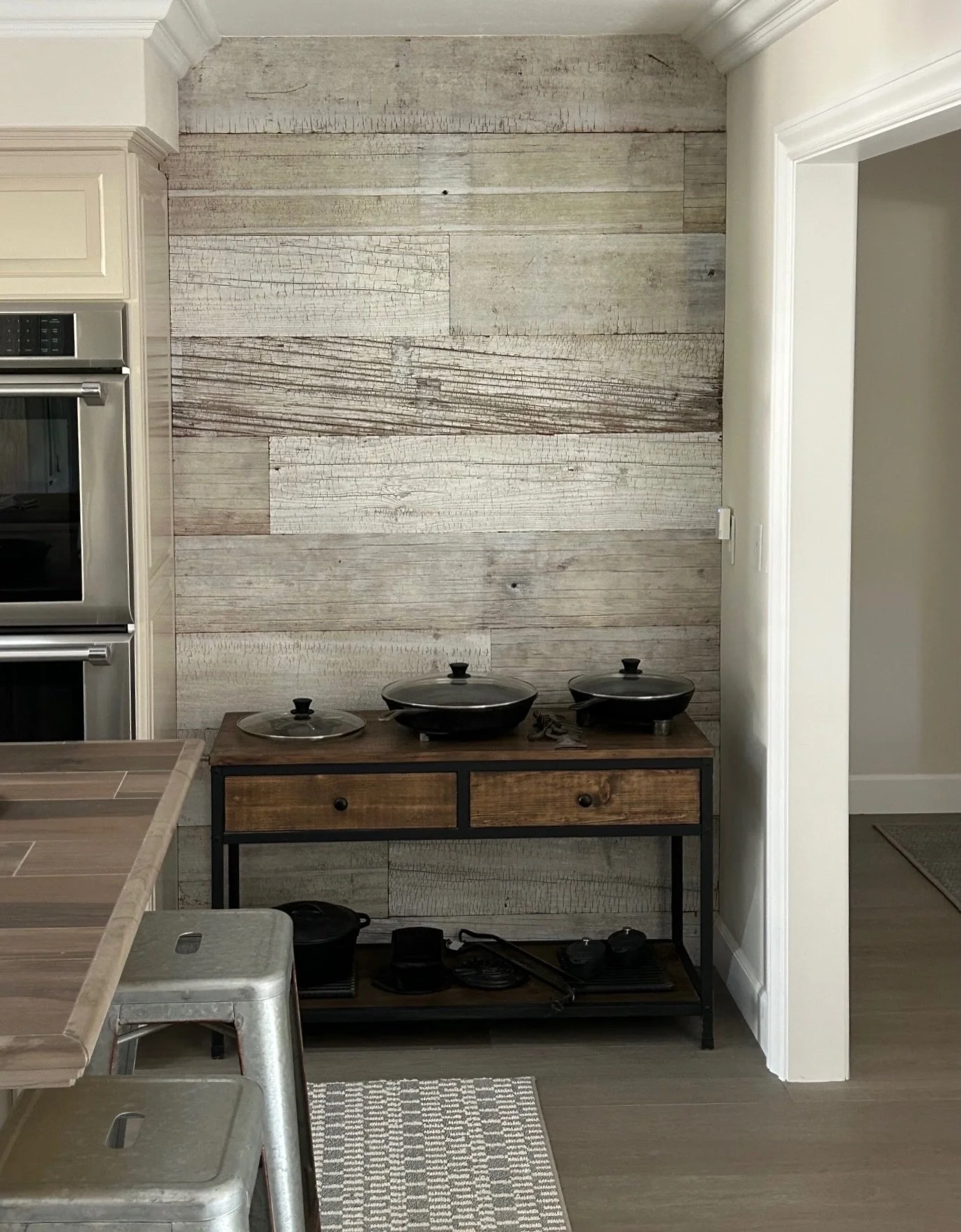 Whitewashed redwood shiplap used across both the kitchen and staircase wall creates a cohesive look, complete with a hidden door built in.

Redwood available in 2x10 for your next project.
&bull;
&bull;
&bull;
#redwood #shiplapwalls #hiddendoor #usre