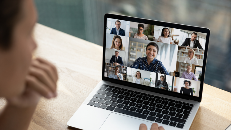 A student in a live video class with classmates on screen
