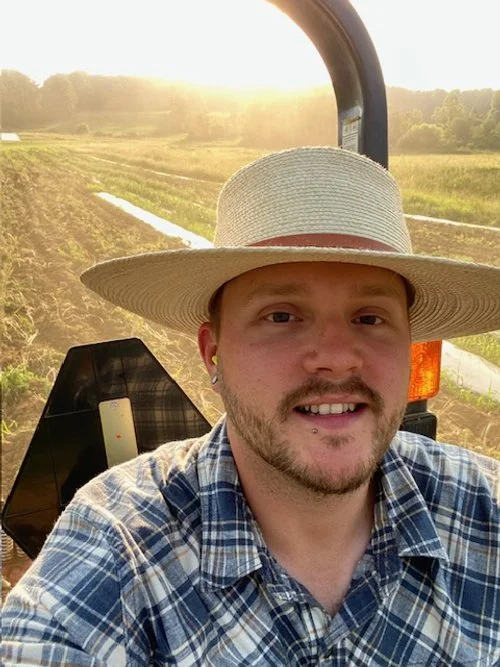 West on a tractor.jpeg