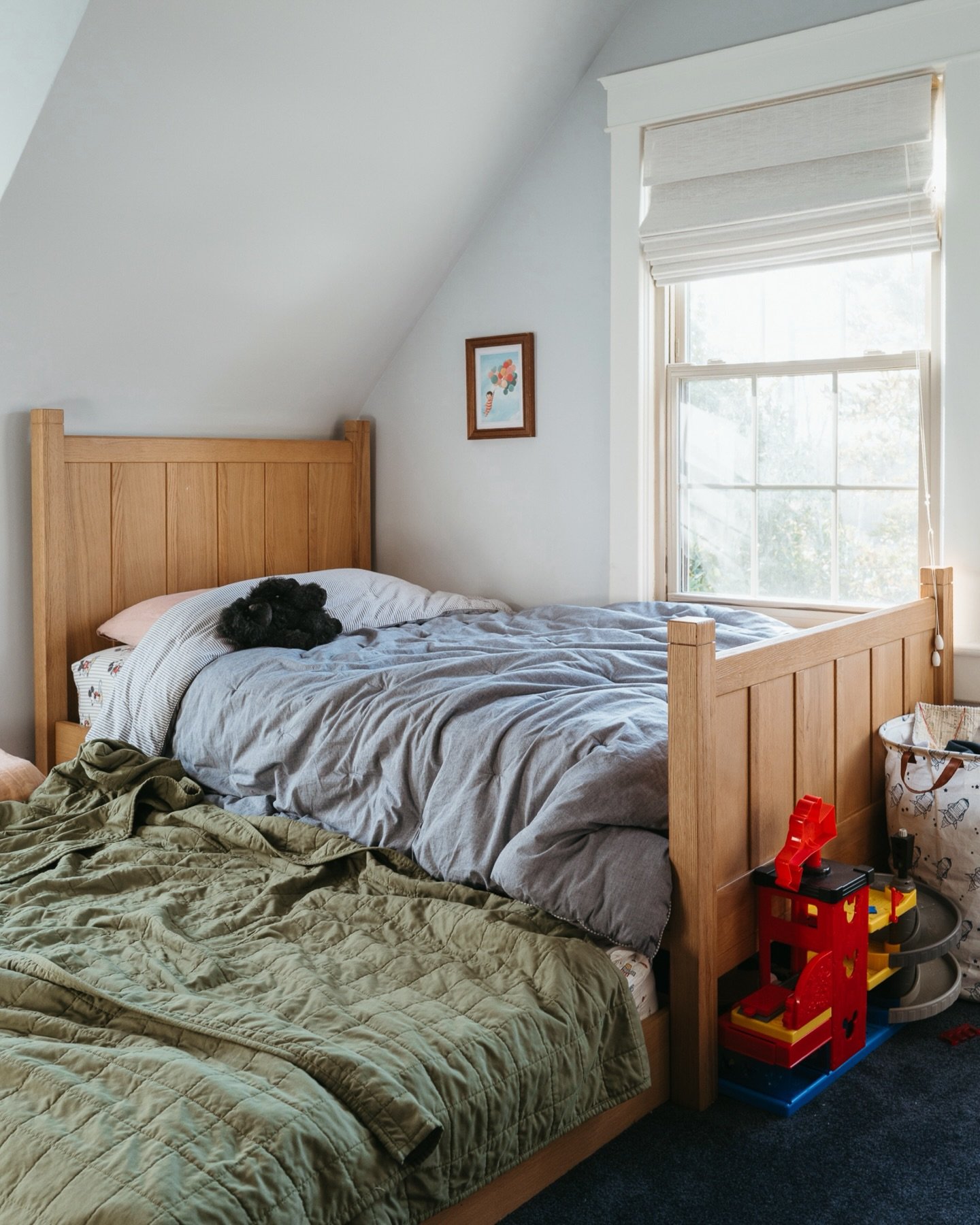 It&rsquo;s the red marble on the carpet that I didn&rsquo;t notice until post. The pullout sleeper, keeping Little safe from bad dreams. The sleepy crinkles in both comforters. The gorilla waiting for another night of snuggles. The original ceiling l