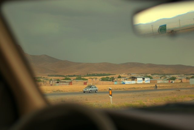 Shahre Kord. En route to Shahre Kord, with mountains in the distance on a cloudy day.