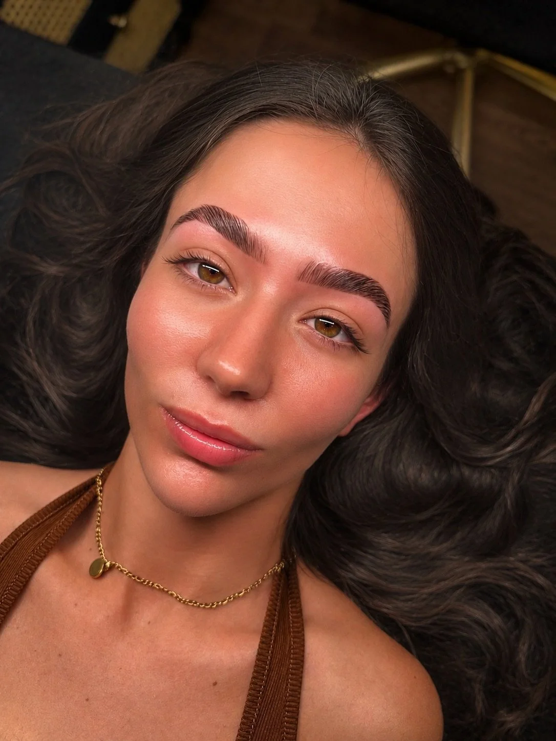 Client with sculpted brows and hybrid dye for added definition