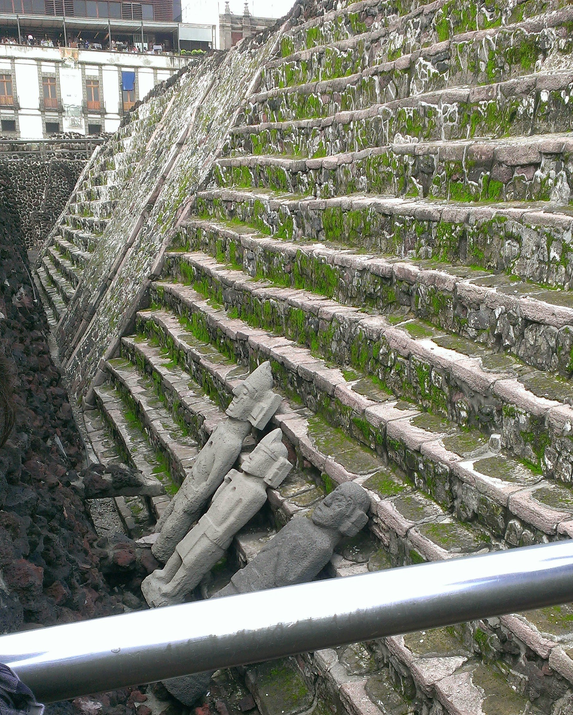 Figure 4. Stairs at the foot of Templo Mayor with sculptures that may have been the southern star brothers from the myth (Whitehouse 2014).