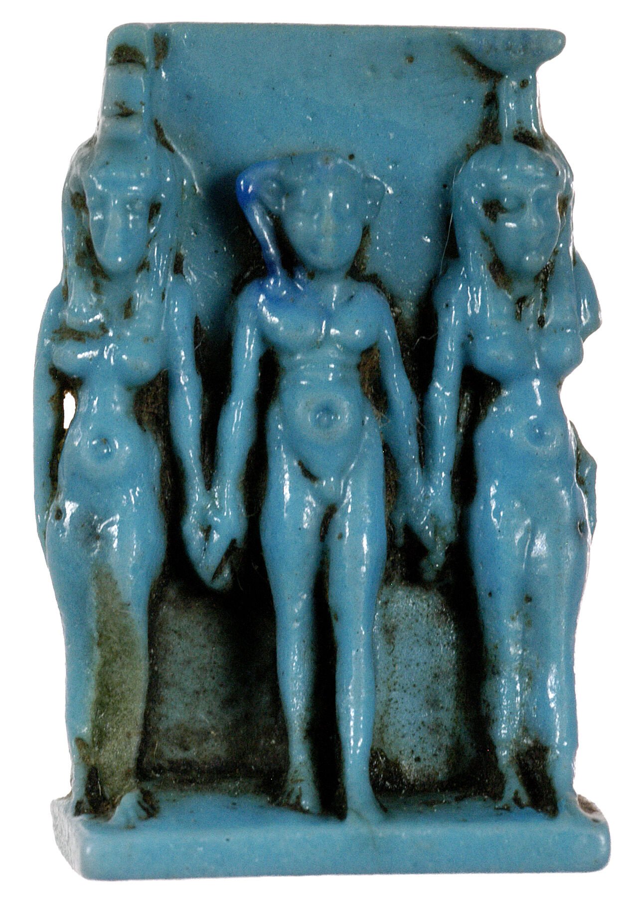 Figure 32. Amulet with the triad Isis-Harpokrates-Nephthys, Egyptian, Third Intermediate Period, ca. 1069–664 BC. Faience. Eton College, Myers Collection.