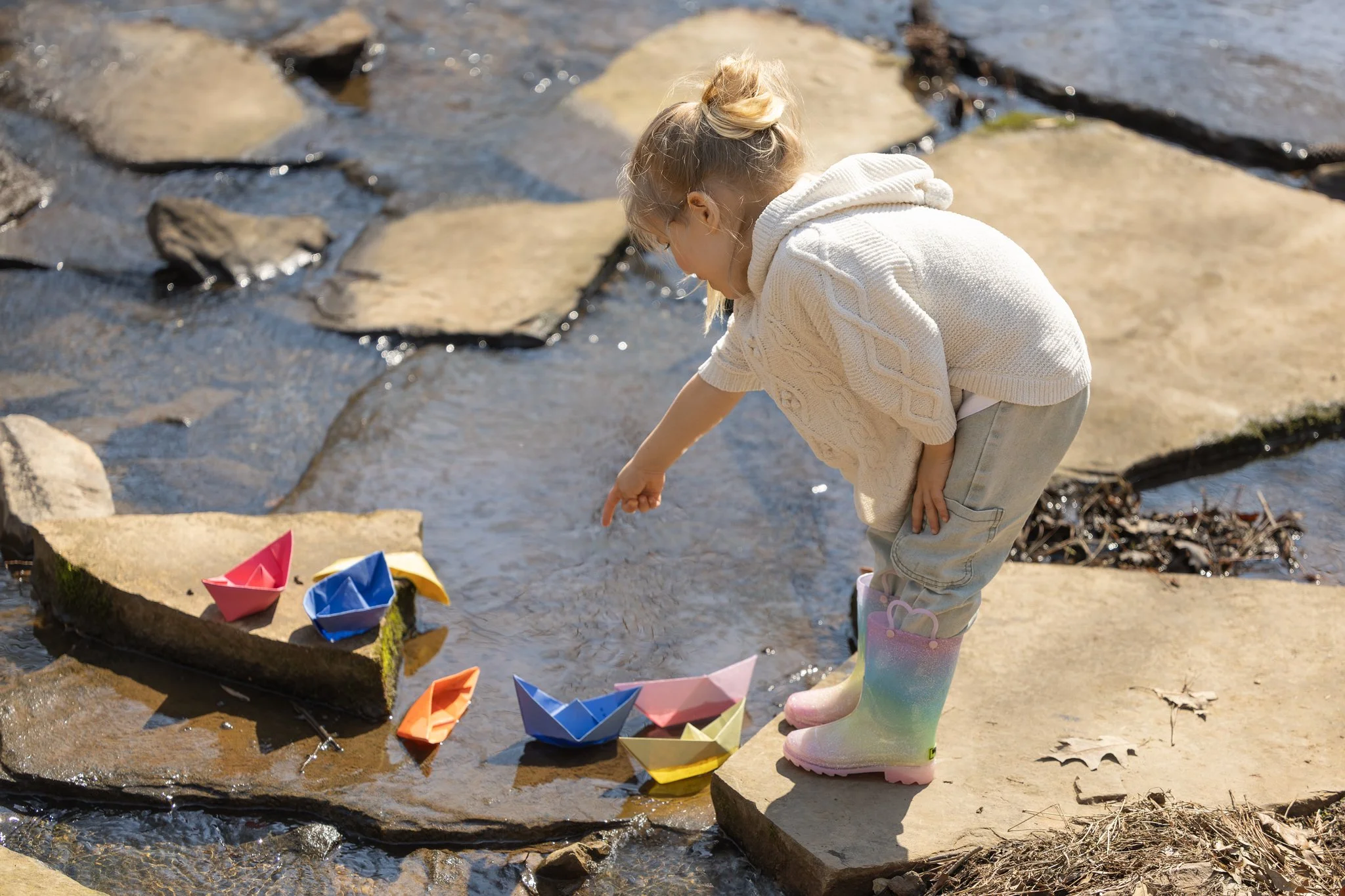 2026_03_01_IMG_1027 Girl SPoints to Paper Boat.jpg