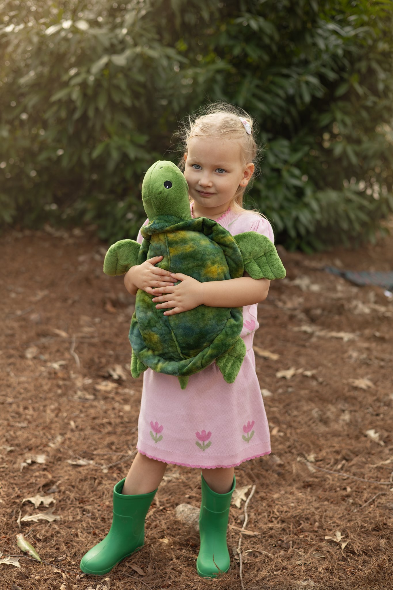 2026_03_01_IMG_1741 Girl Hugs Turtle Toy.jpg