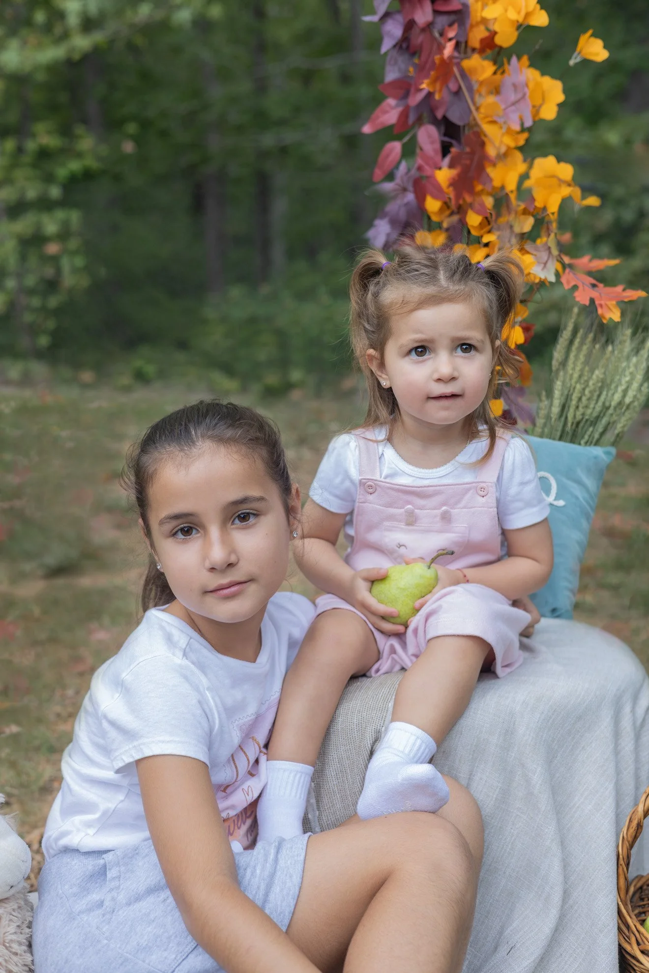 Older and Younger Sister with Pear