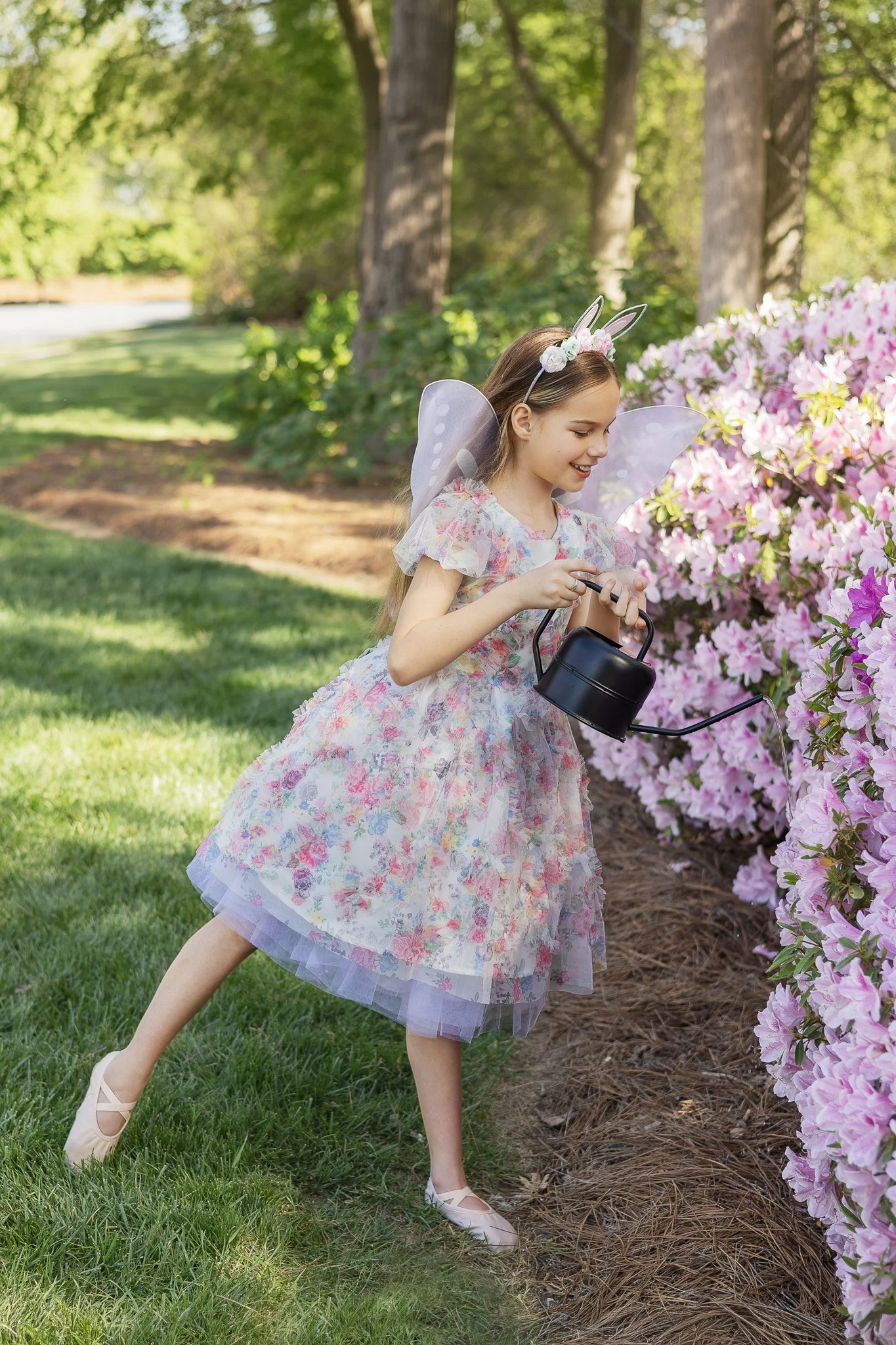 IMG_2026_04_10_0491Girl Waters Flowers.jpg