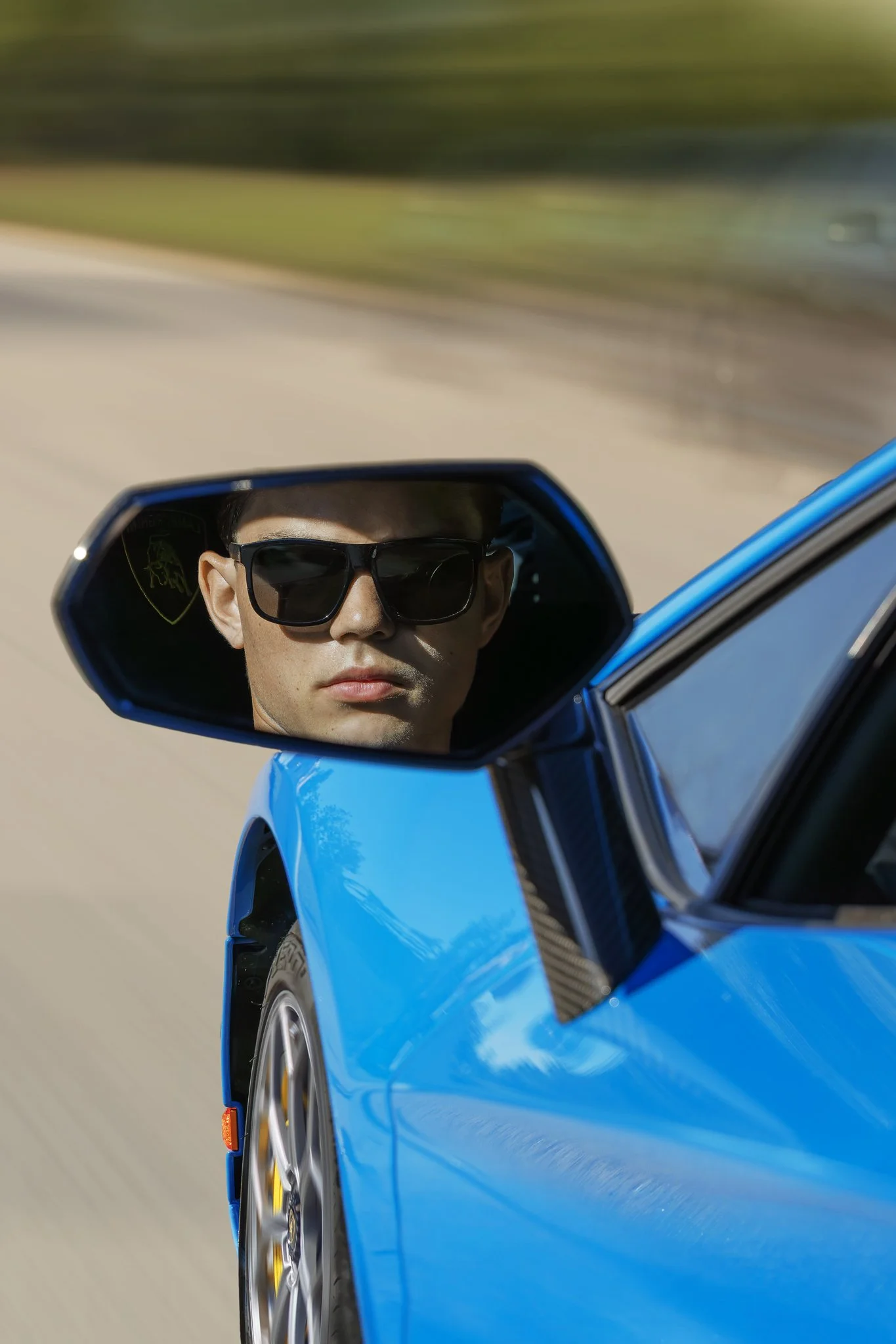 2024_09_22_0206 Young Man Blue Car Destanation Unknown-vertical.jpg