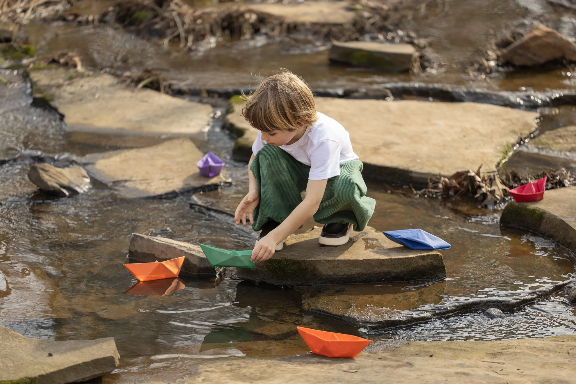 Child and Paper Boats 2026_03_01_IMG_2295 Boy Starting Paper Boat.jpg
