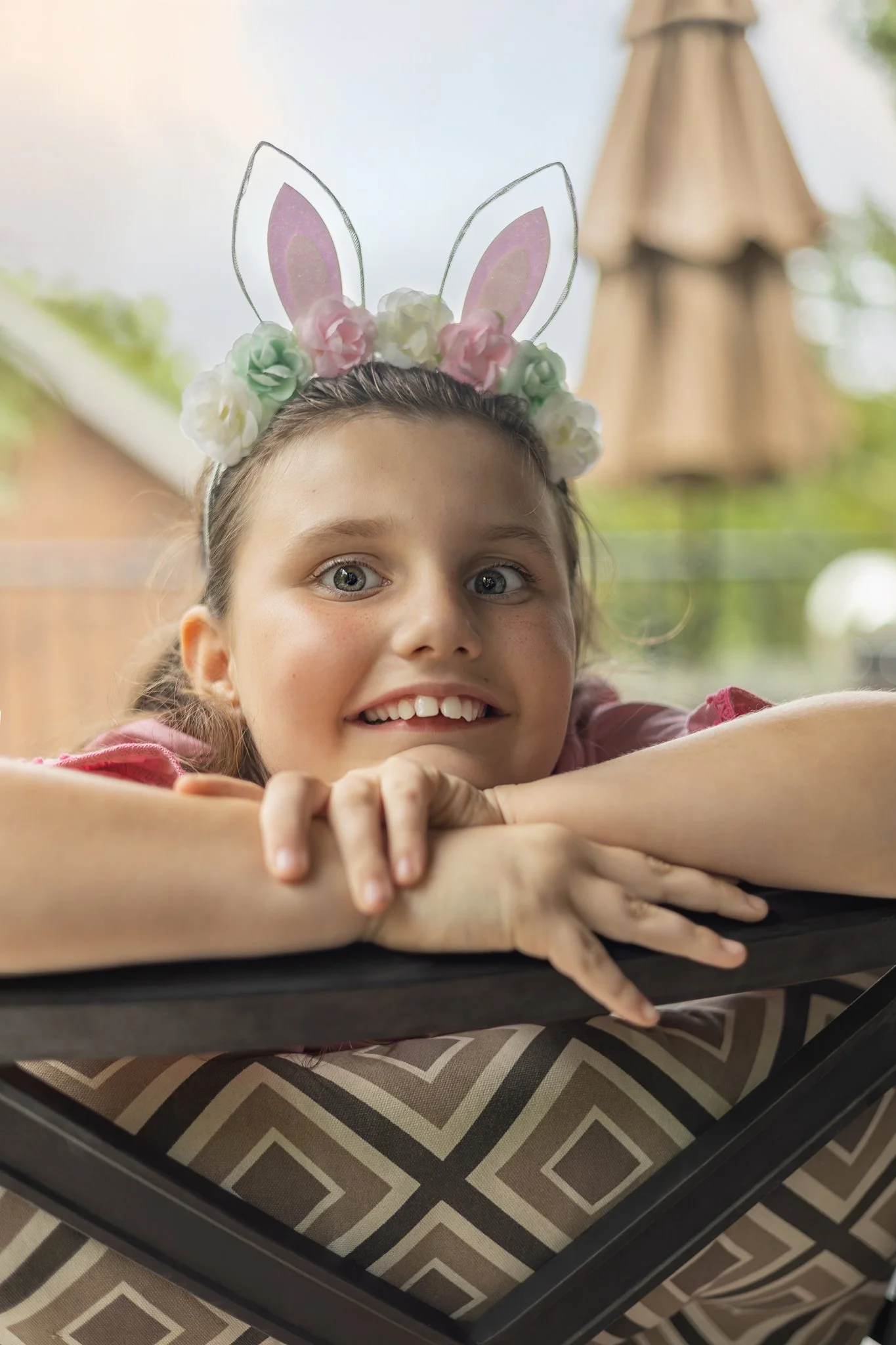 IMG_2026_04_05_0293 Girl with Bunny Ears on Chair.jpg