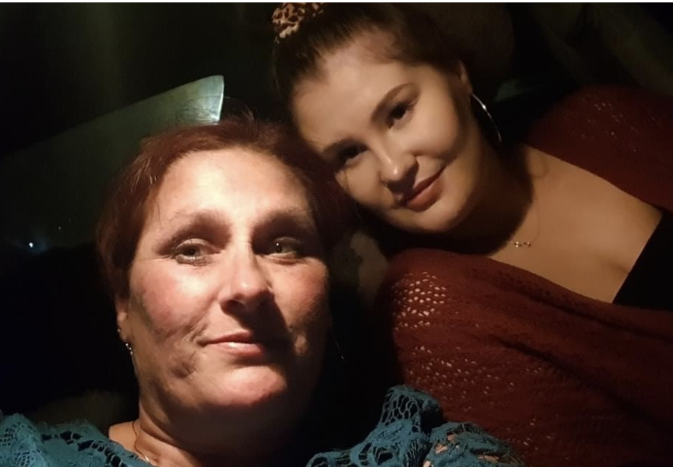 Shay and her mum close together, smiling