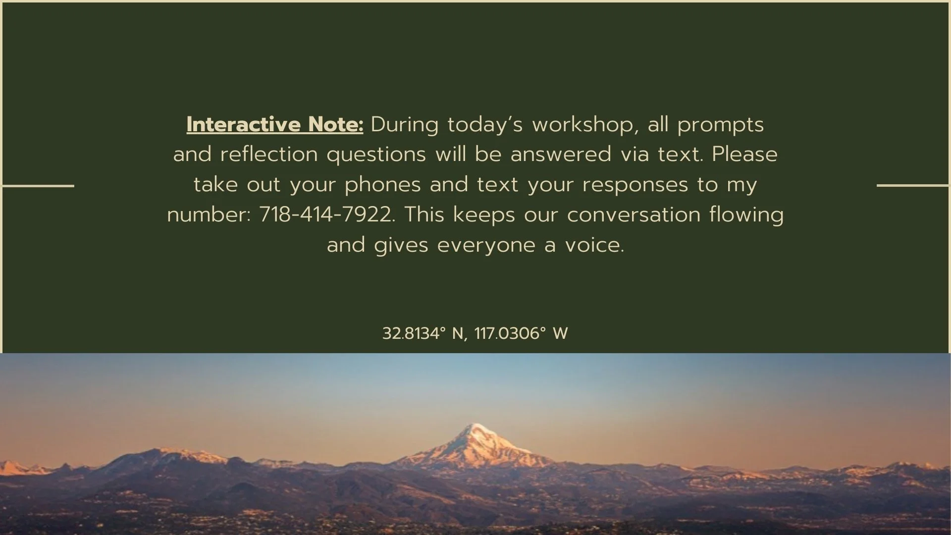 A green informational sign with instructions for a workshop, including a phone number, and a scenic view of snow-capped mountains at sunset below the sign.