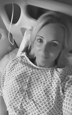 Woman in hospital gown