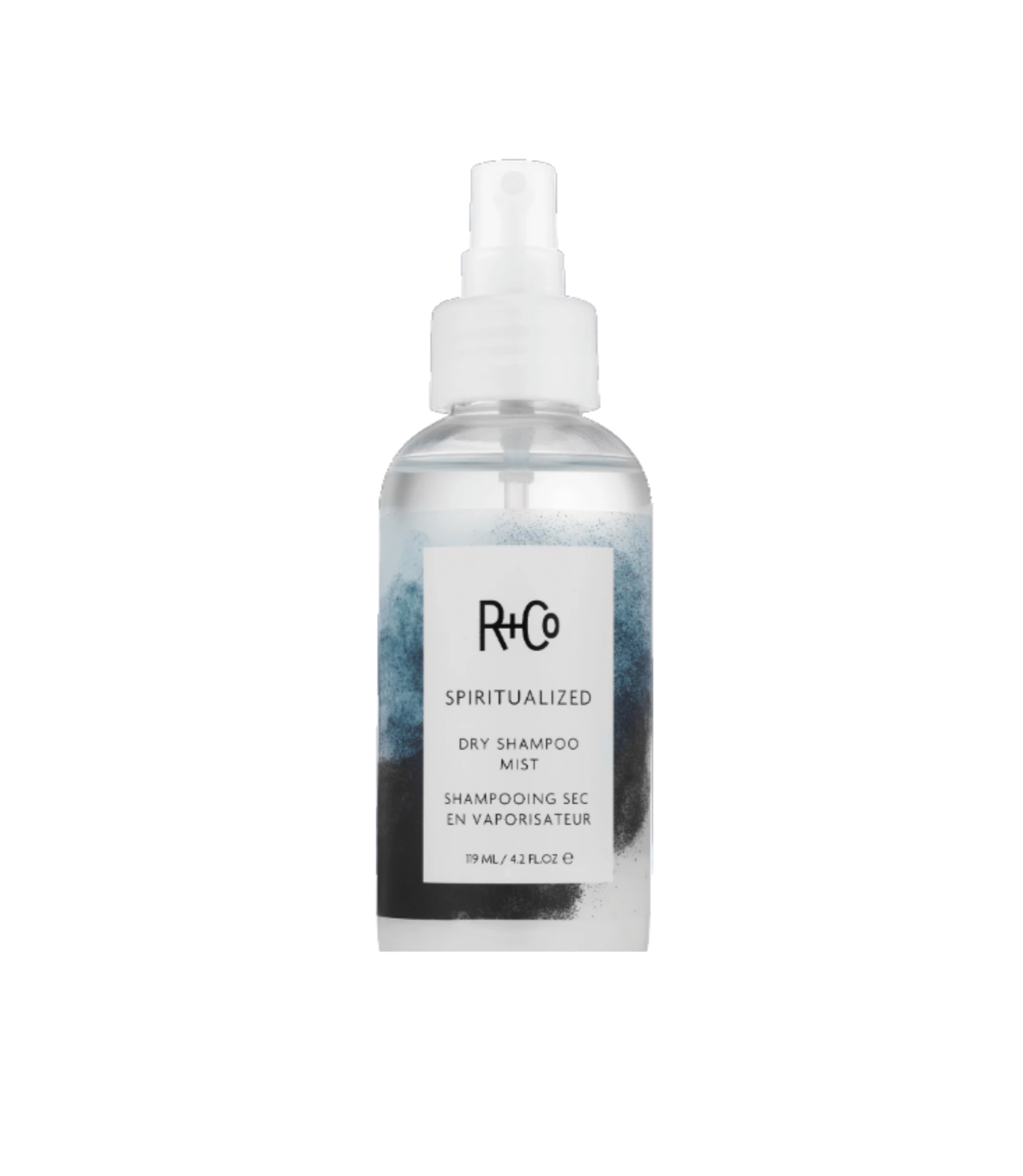 A clear spray bottle labeled 'R+Co Spiritualized Dry Shampoo Mist' with a white spray nozzle.